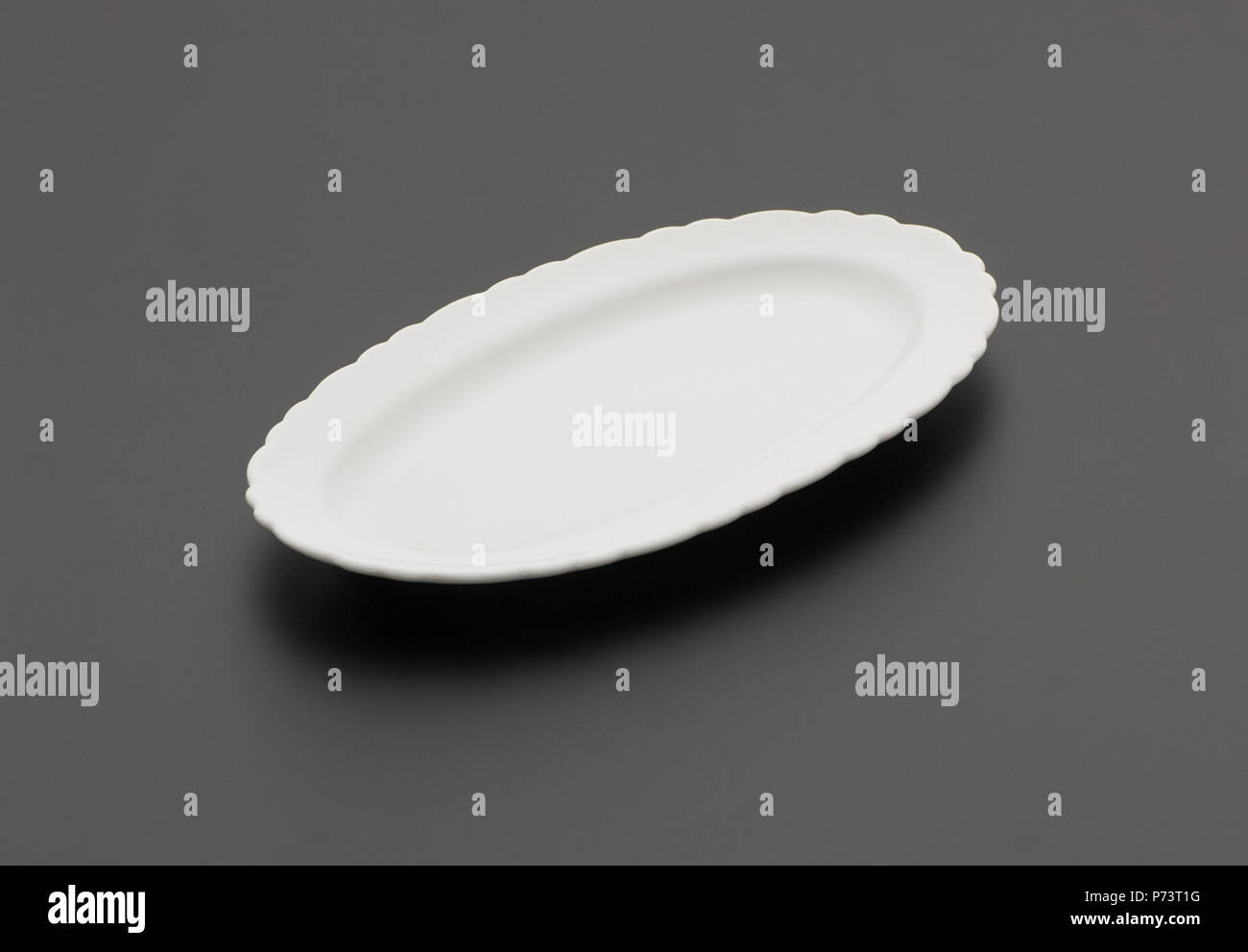 ceramic kitchen plate on black background Stock Photo