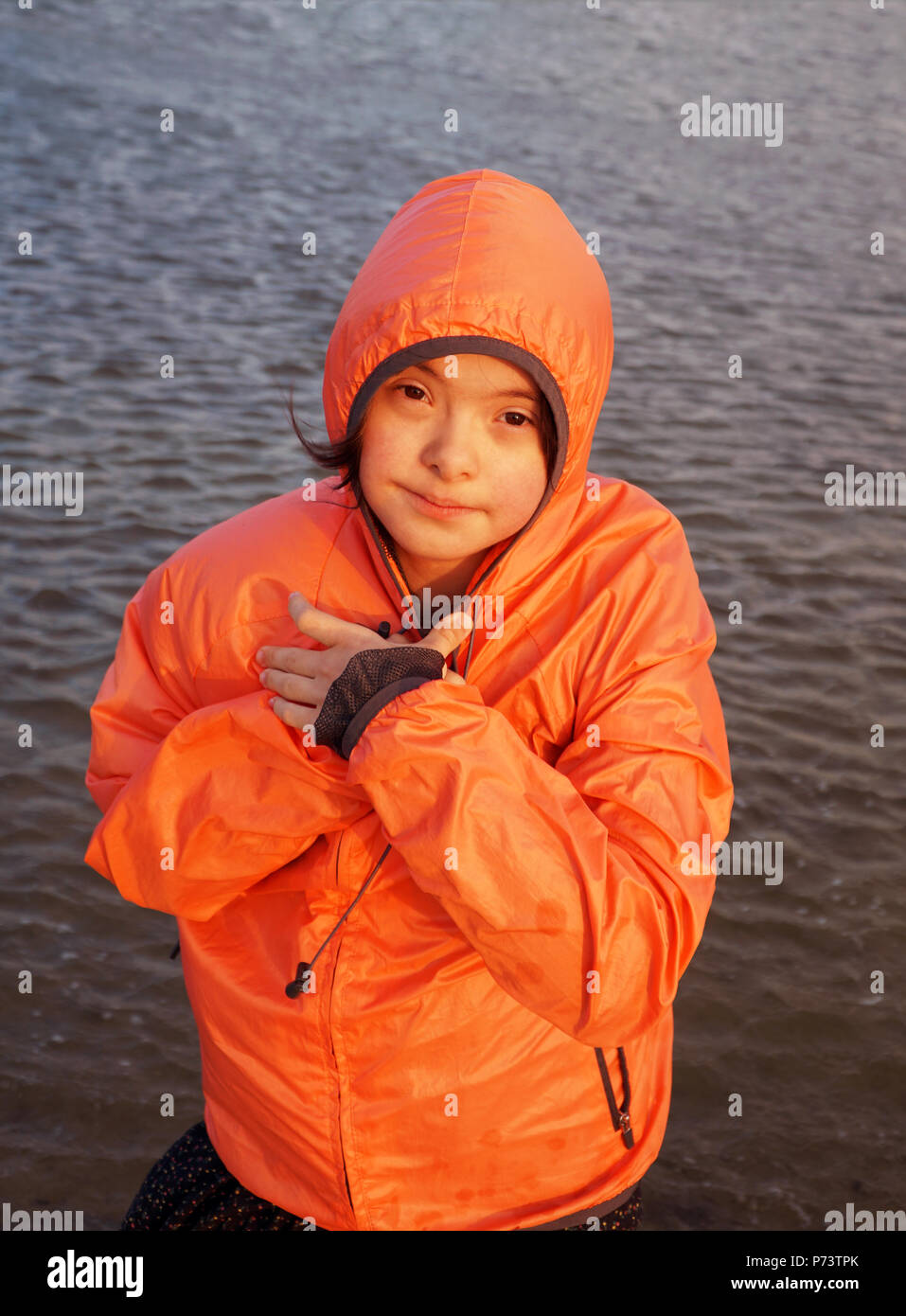 Portrait of little girl smiling outside Stock Photo