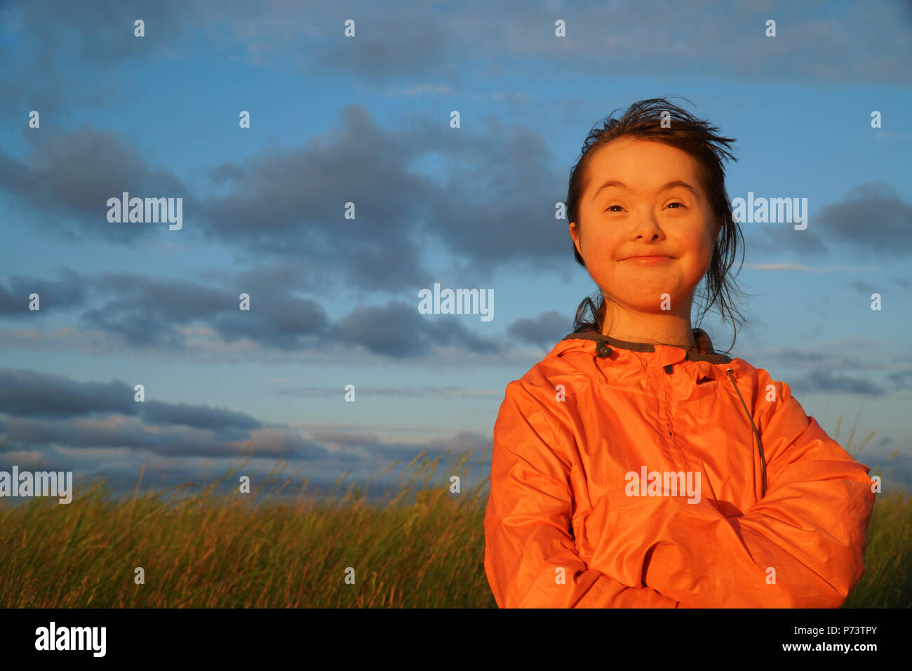 Portrait of little girl smiling outside Stock Photo - Alamy