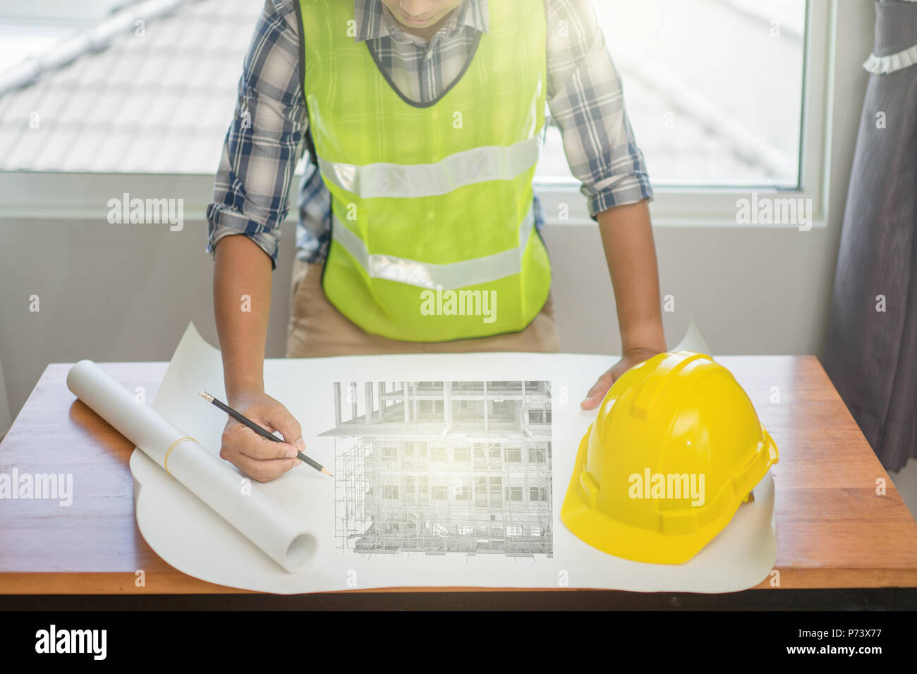 Architect working on blueprint. Architects workplace, Architectural project, Construction concept, Engineering tools Stock Photo