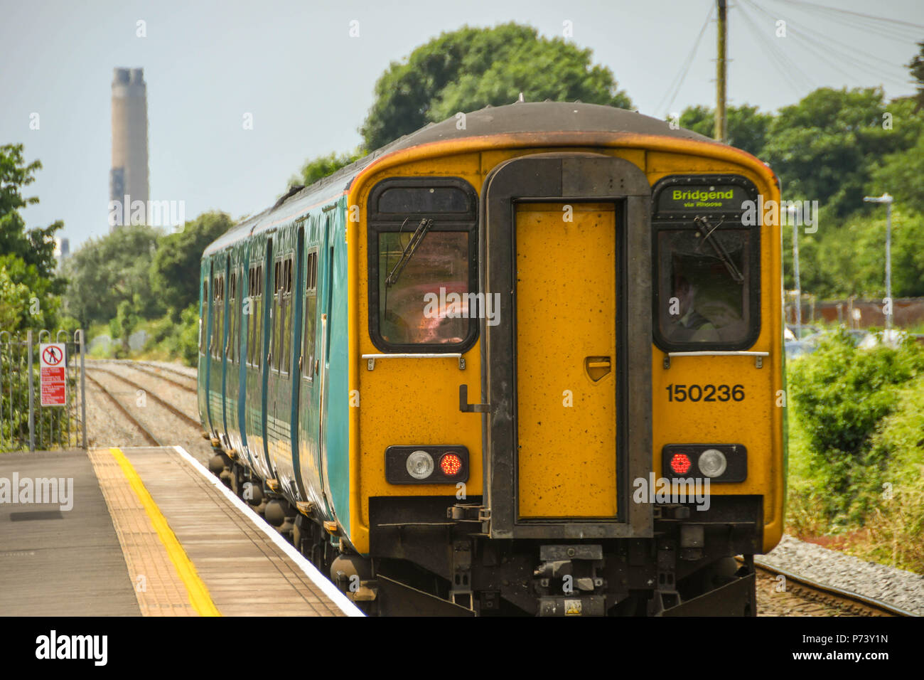 Diesel commuter train departing Platform 2 at Rhoose Cardiff International Airport railway station in the Vale of Glamorgan, south Wales Stock Photo