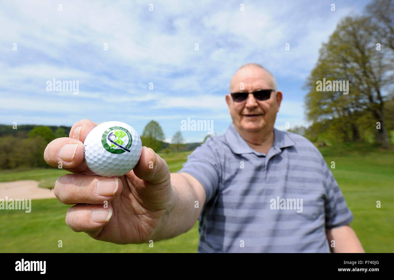 Retired Chief Master Sgt. Charles E. Milam holds a Golf-Club Pfälzerwald e.V. ball at the Golf-Club Pfälzerwald e.V. in Waldfischbach-Burgalben, Germany, May 11, 2017. In 1966, Milam was awarded the Air Force Commendation Medal for building a control panel out of wiring, switches, and colored light-emitting diodes that, with a realistic script, later became the simulator used by the security police controllers working at launch facilities. Stock Photo