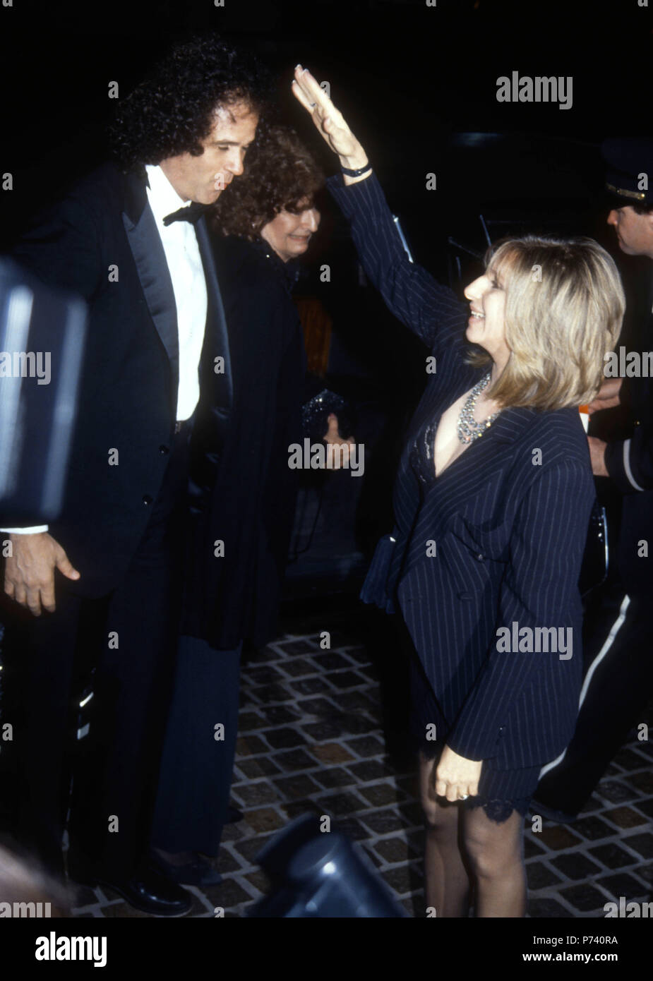 BEVERLY HILLS, CA - JANUARY 18: (L-R) Composer Richard Baskin and Singer/actress Barbra Streisand attend the 49th Annual Golden Globe Awards on January 18, 1992 at the Beverly Hilton Hotel in Beverly Hills, California. Photo by Barry King/Alamy Stock Photo Stock Photo