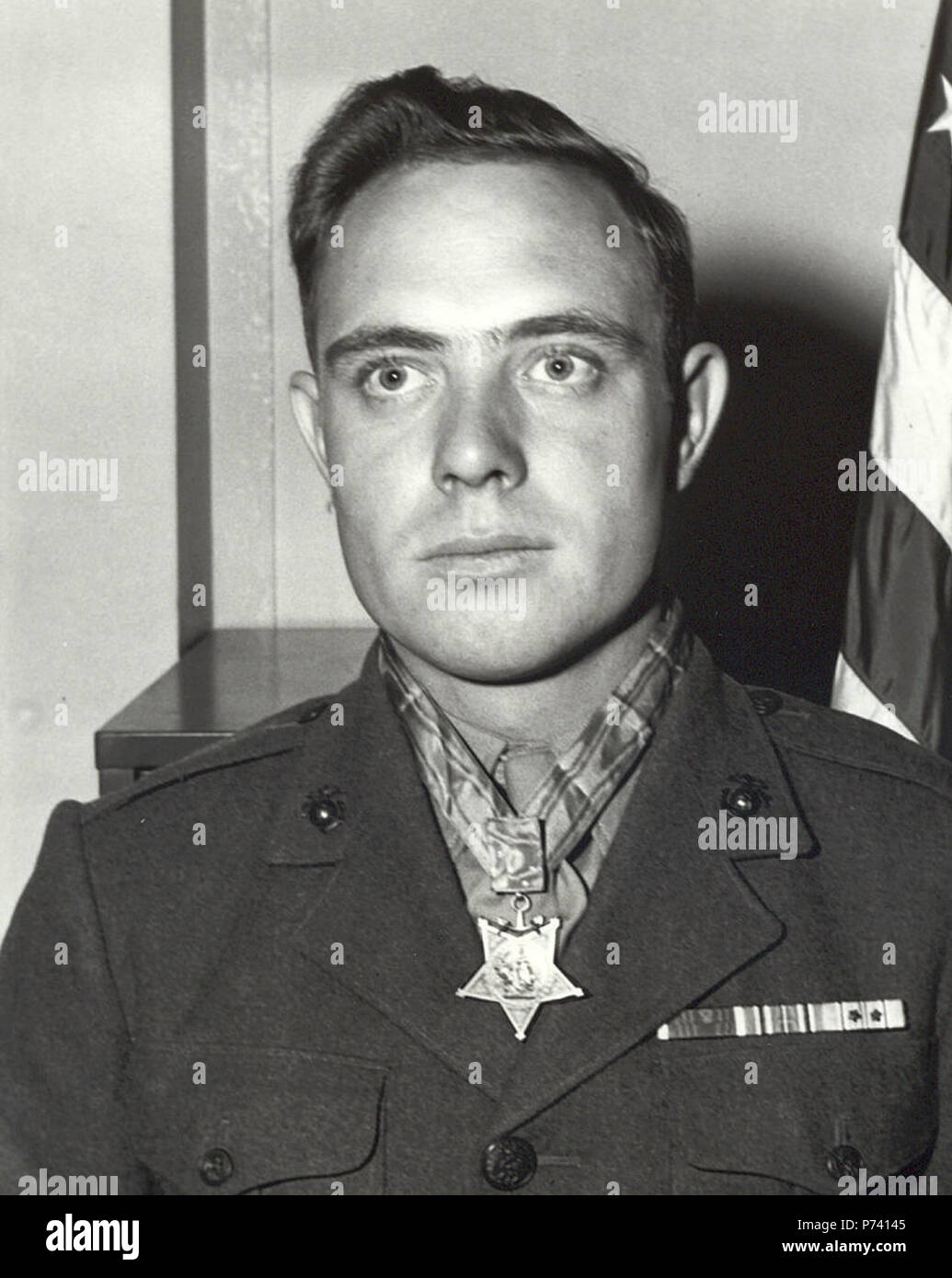 U.S. Marine Corps Cpl., Hershel 'Woody' Williams, received the Medal of Honor for his gallantry in action during the Battle of Iwo Jima, Feb. 23, 1945. Williams fought for four hours through small-arms fire while returning charges at the enemy with his flamethrower. Stock Photo