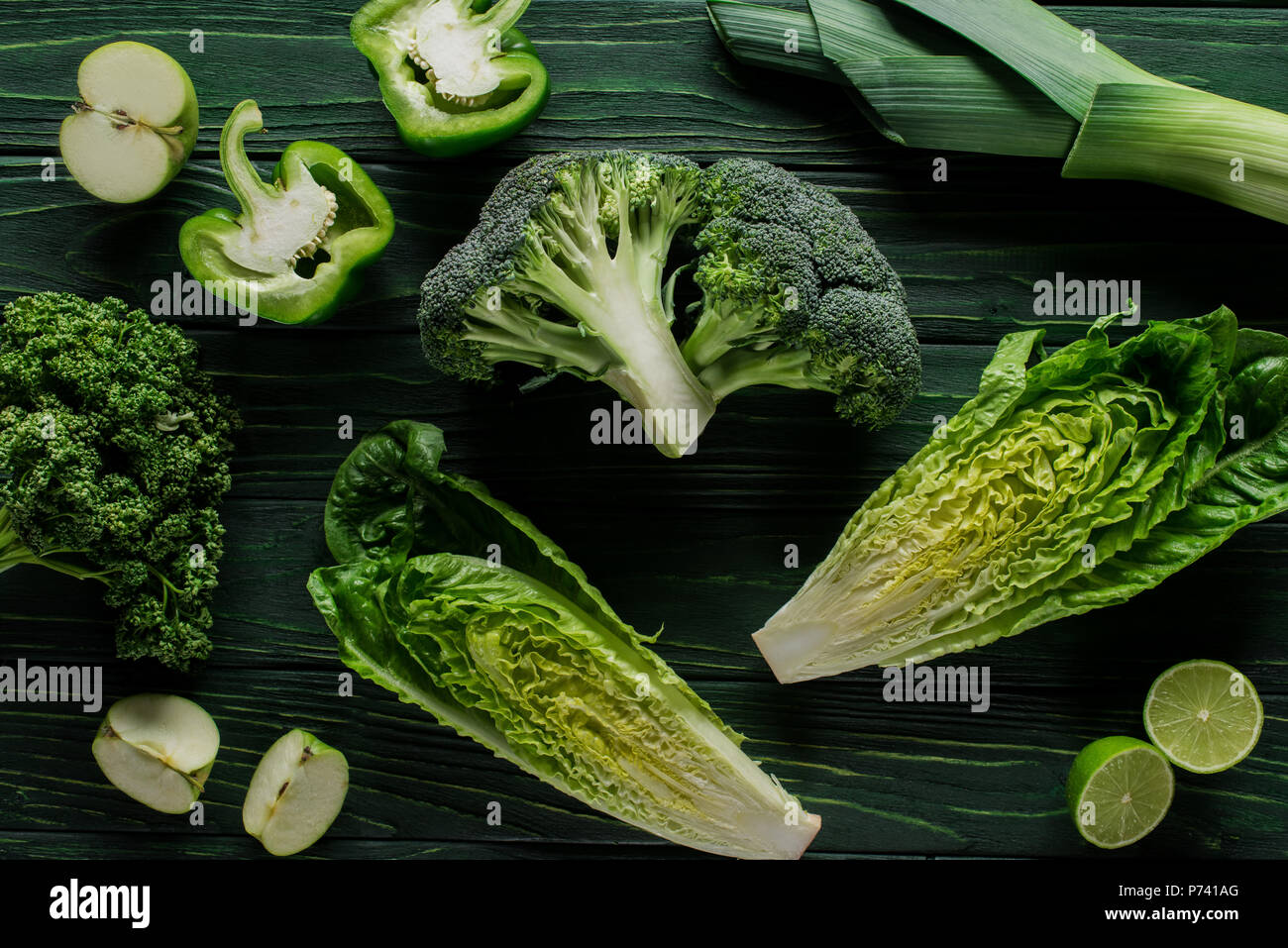 top view of green vegetables on green table, healthy eating concept ...