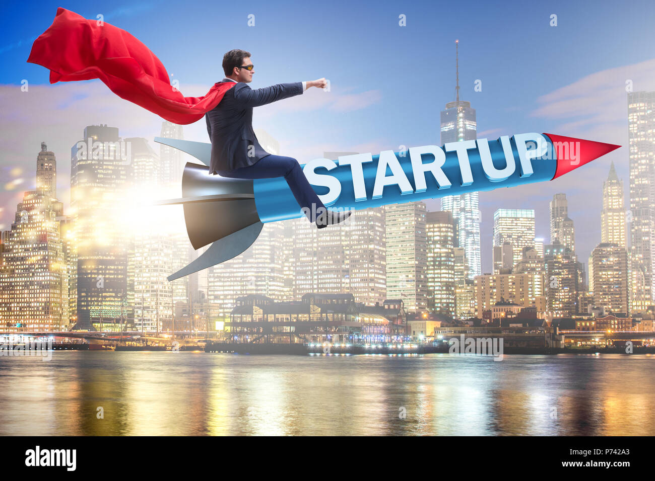 Superhero businessman in start-up concept flying rocket Stock Photo - Alamy