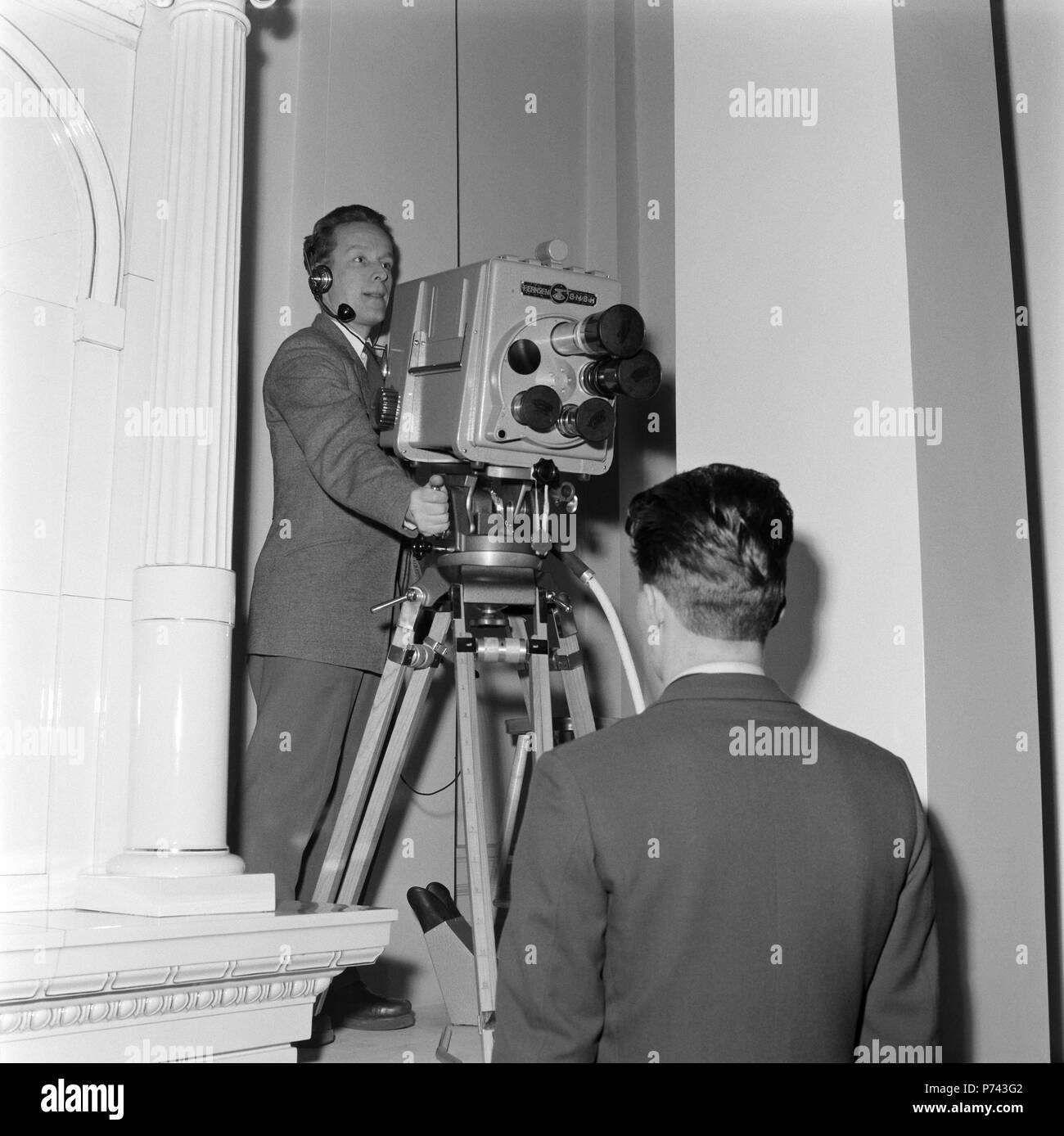 The first broadcast of the Finnish Independence Day celebrations, 6.12.1957. This picture is taken in the presidential residence in Helsinki. Cameraman Pentti Valkeala is testing German Fernseh GmbH's Orthicon camera, type KIO. Stock Photo