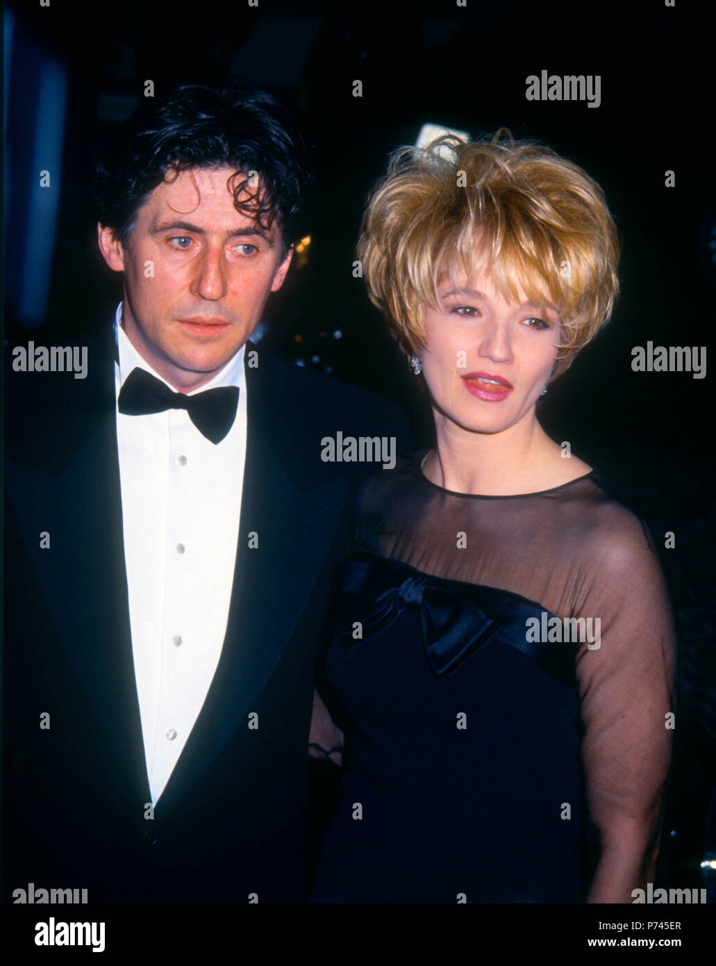BEVERLY HILLS, CA - JANUARY 18: (L-R) Actor Gabriel Byrne and wife actress Ellen Barkin attend the 49th Annual Golden Globe Awards on January 19, 1992 at the Beverly Hilton Hotel in Beverly Hills, California. Photo by Barry King/Alamy Stock Photo Stock Photo