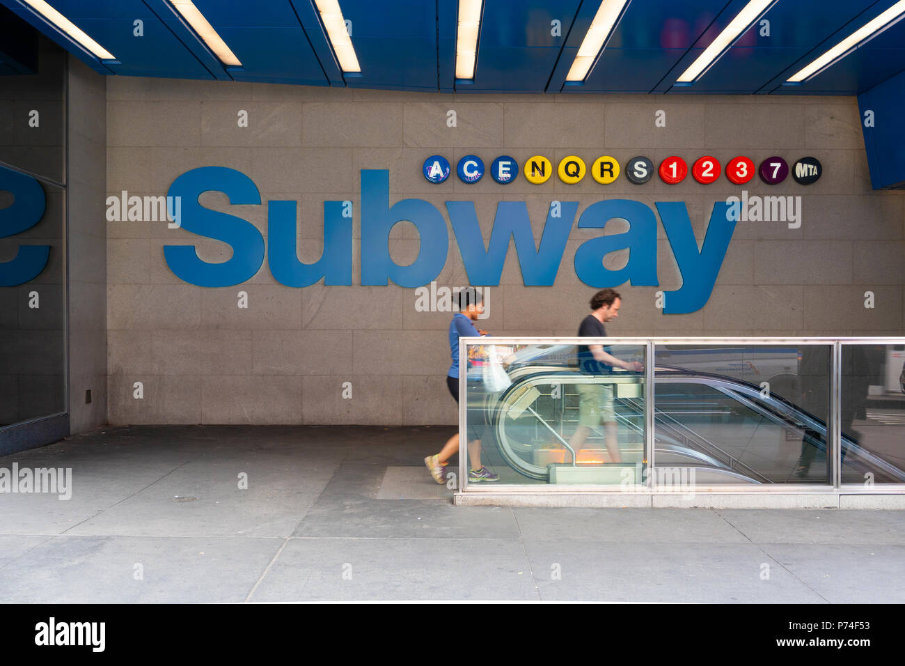 People entering a subway station in New York Stock Photo