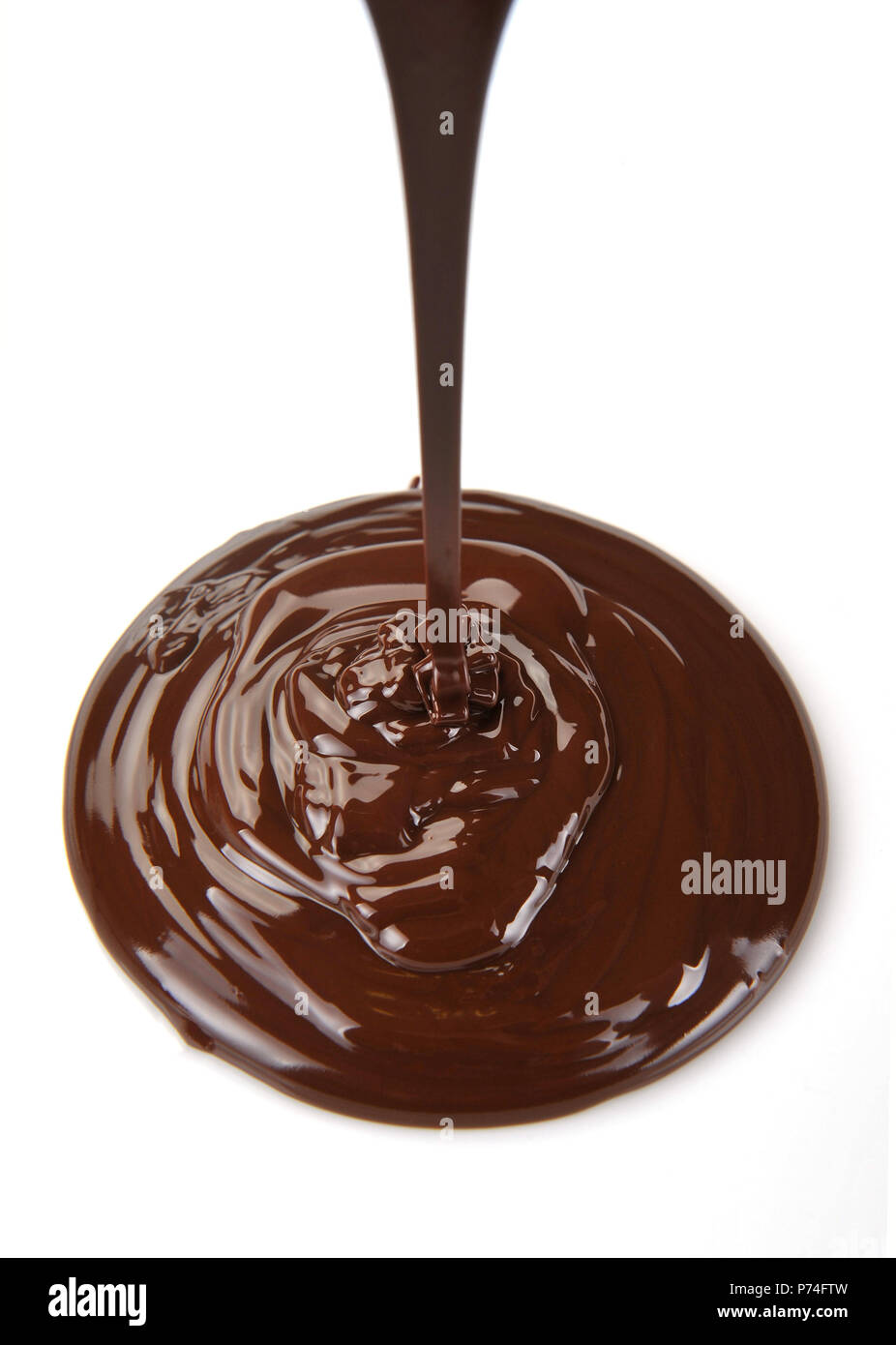 Chocolate flow isolated on white background Stock Photo