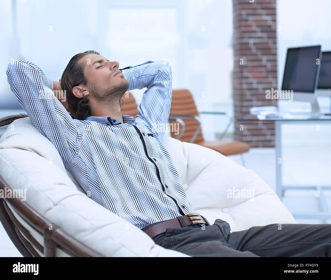 businessman relaxing in a comfortable chair Stock Photo - Alamy