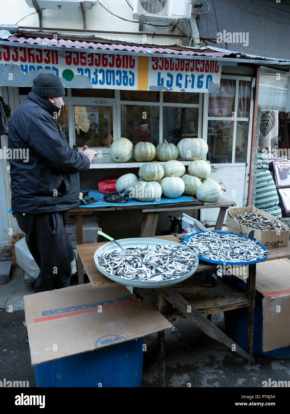 Telavi, Georgia - December 3, 2016 : man selling fresh fish at local street market Stock Photo
