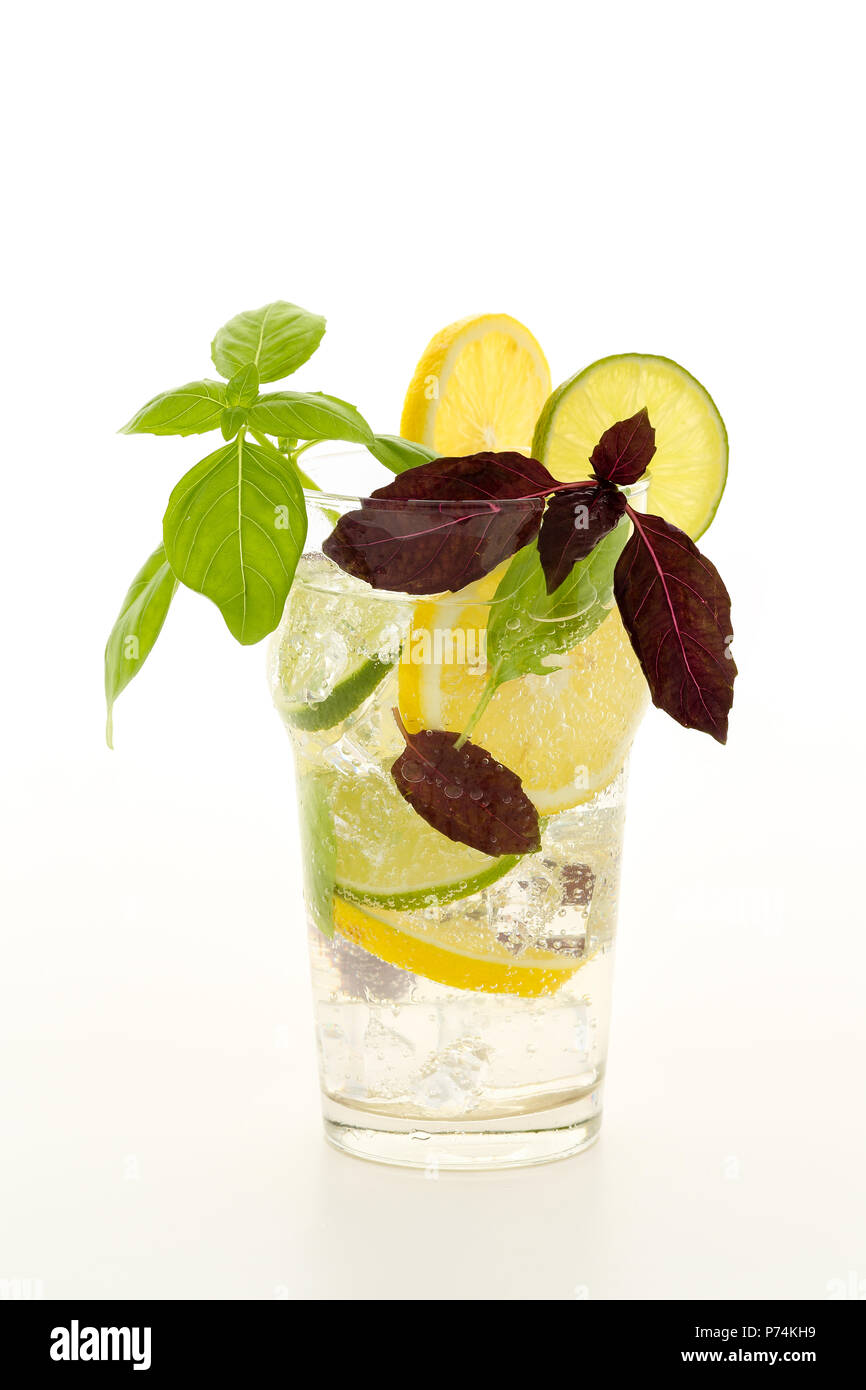 Fresh summer fizzy cooler cocktail with lemon and limette wheels, ice