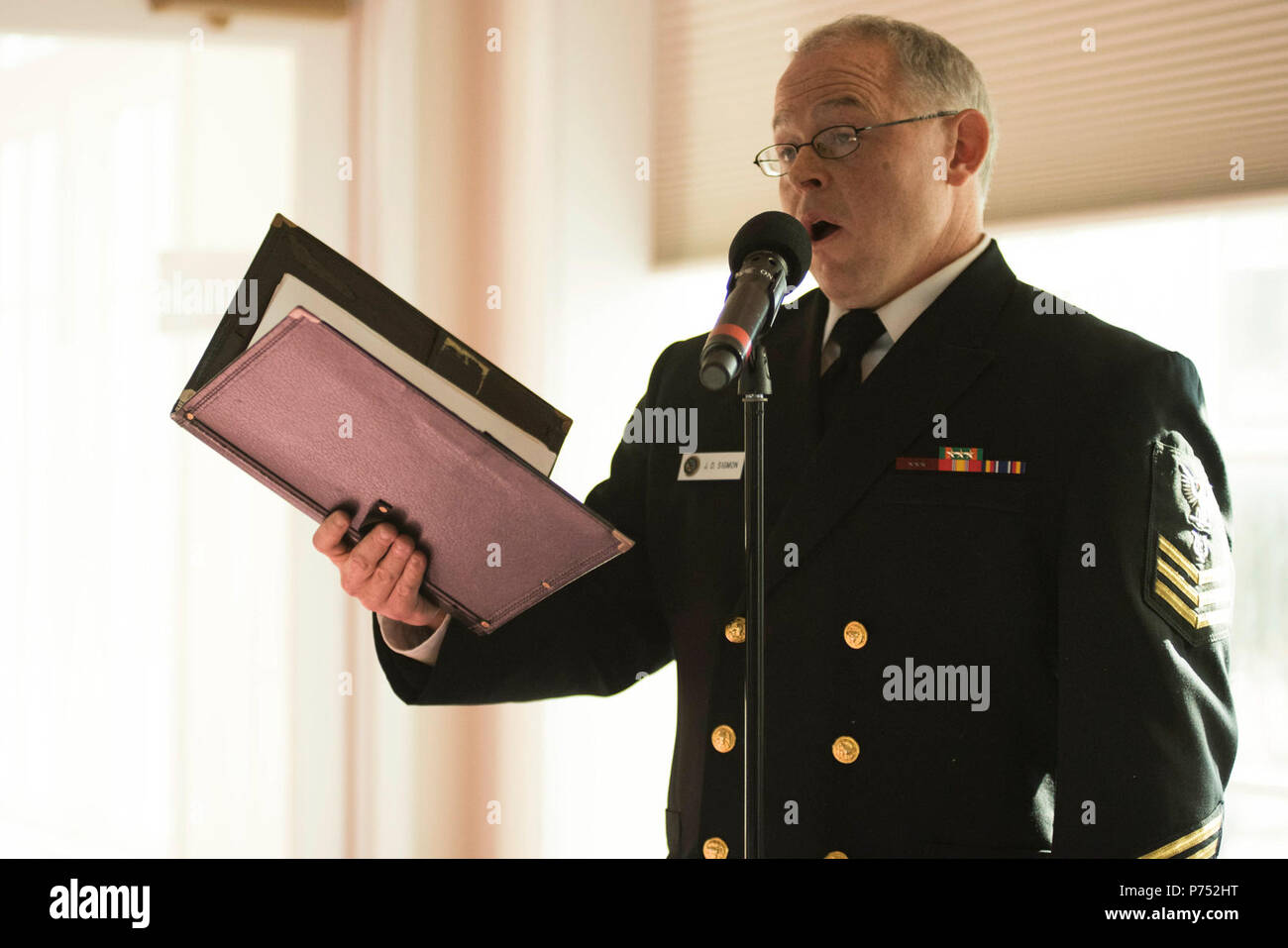 ANNANDALE, VIRGINIA  (October 30, 2016) Petty Officer 1st Class David Sigmon sings 'Shanandoah' during the U.S. Navy Band Sea Chanters chorus' 60th anniversary concert. The Sea Chanters celebrated their 60th anniversary with a concert in Annandale, Virginia, featuring alumni from the group. The chorus was formed as an all-male group in 1956 and tasked with perpetuating the songs of the sea. In 1980, the group added women to their ranks and expanded their repertoire to include everything from Brahms to Broadway. Stock Photo