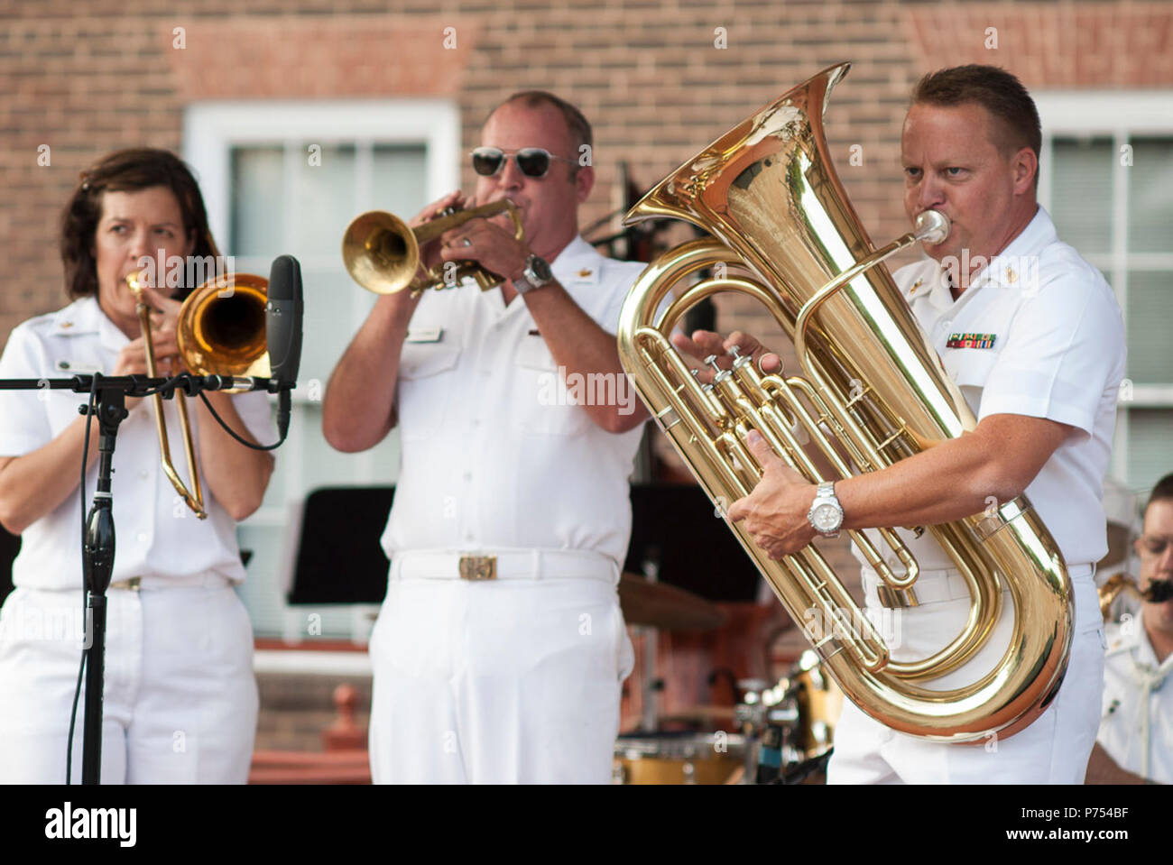ALEXANDRIA, Va. (August 28, 2015) Chief Musician Jen Krupa, Musician 1st Class Tim Stanley, and Senior Chief Musician Matt Neff take center stage with the United States Navy Band Commodores jazz ensemble at Market Square in Old Town. The Commodores play free public concerts throughout the year. Stock Photo