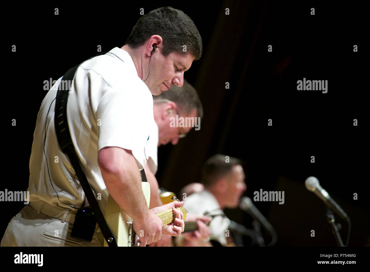 GLENDIVE, Mont. (Sept. 8, 2015) Musician 1st Class Joe Friedman performs with the U.S. Navy Band Country Current at the Dawson County High School Auditorium in Glendive, Mont. The Navy Band's tour featured 14 performances in six states, reaching out to communities that don't normally see the Navy at work. Stock Photo