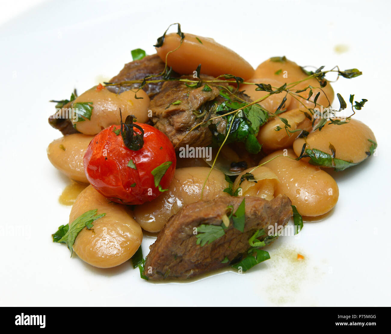 roast lamb with beans in a plate Stock Photo Alamy