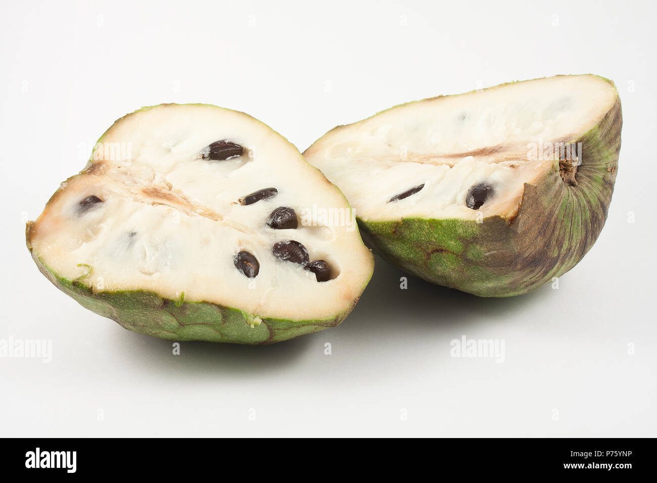 chirimoya halved isolated on white background Stock Photo