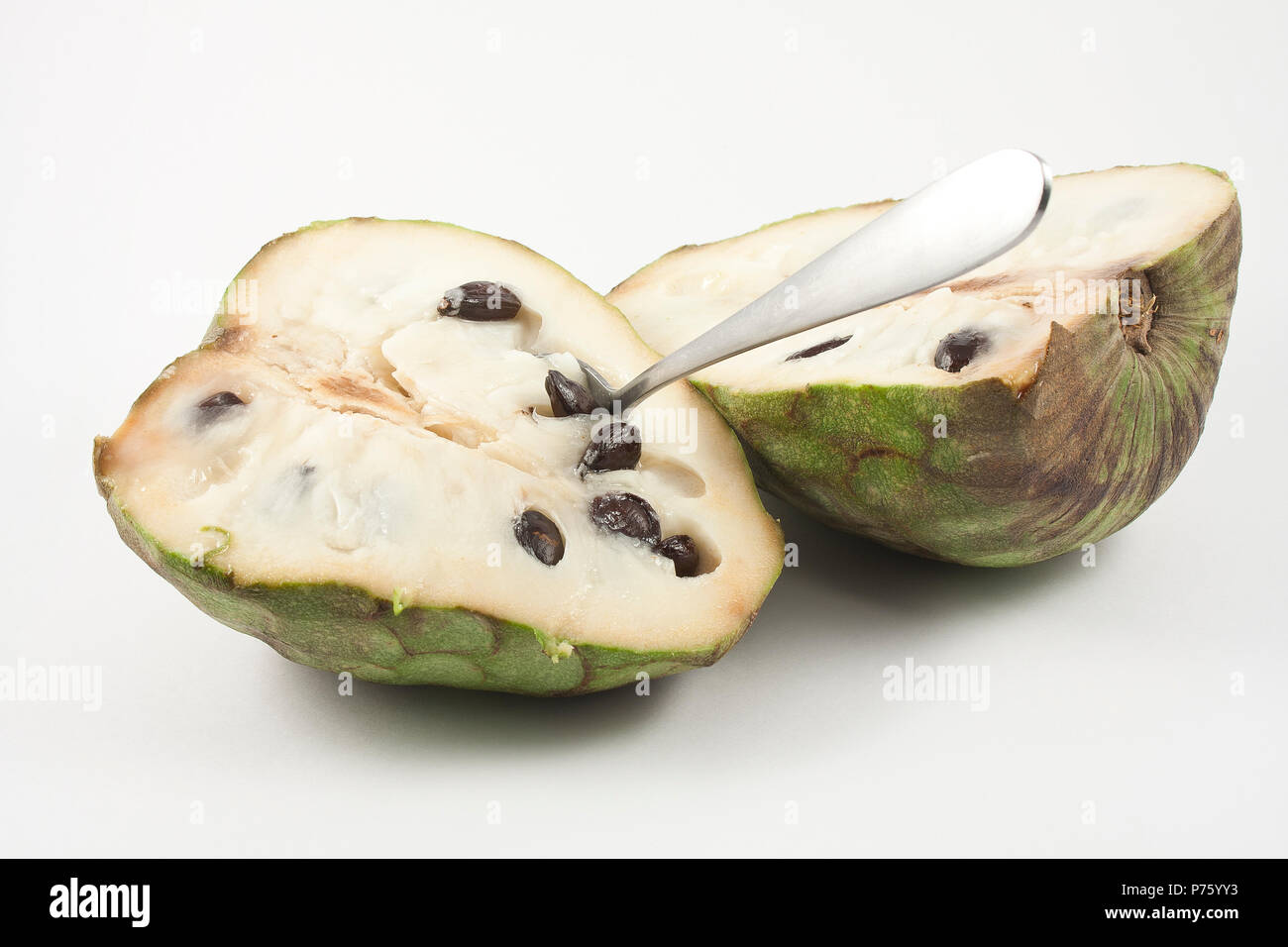 chirimoya halved isolated on white background Stock Photo