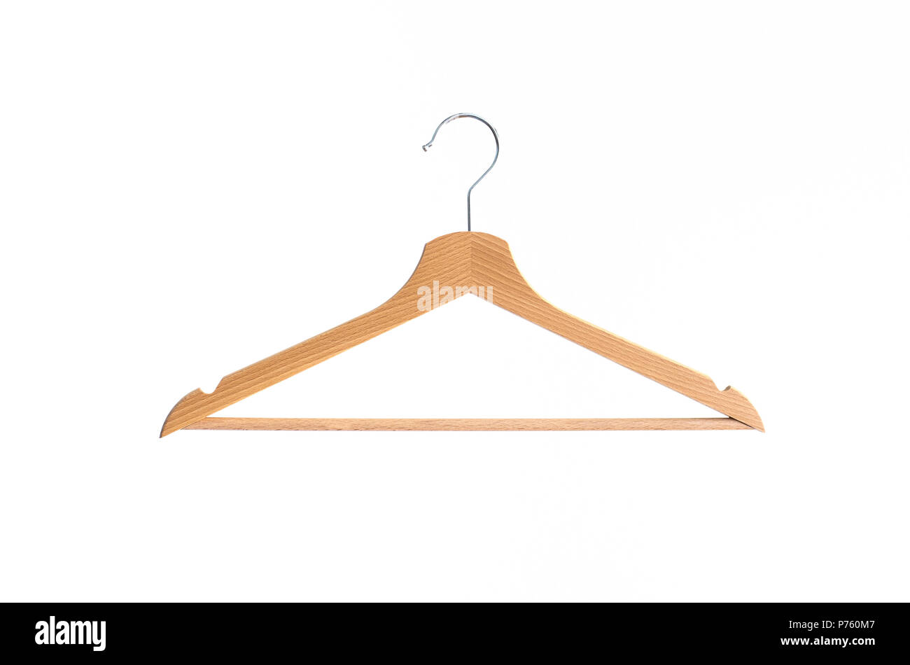 Wooden coat hanger isolated against bright white background Stock Photo