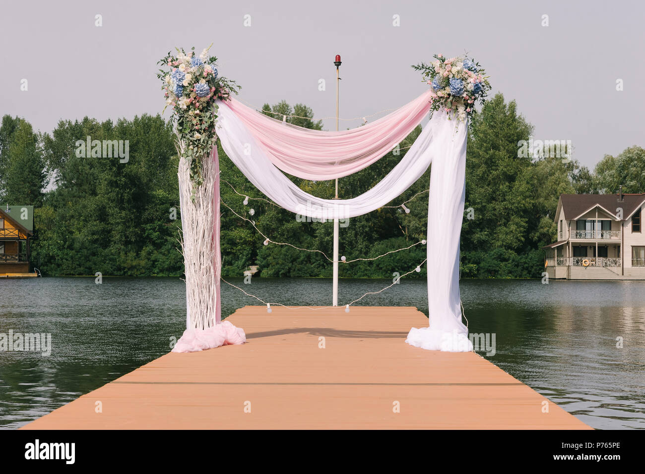 Ceremony On The Bank Of The Lake The Wedding Arch Decorated With
