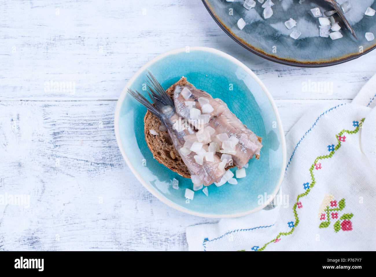 Traditional Dutch herring, with onions and toast. Fat fillets of fish