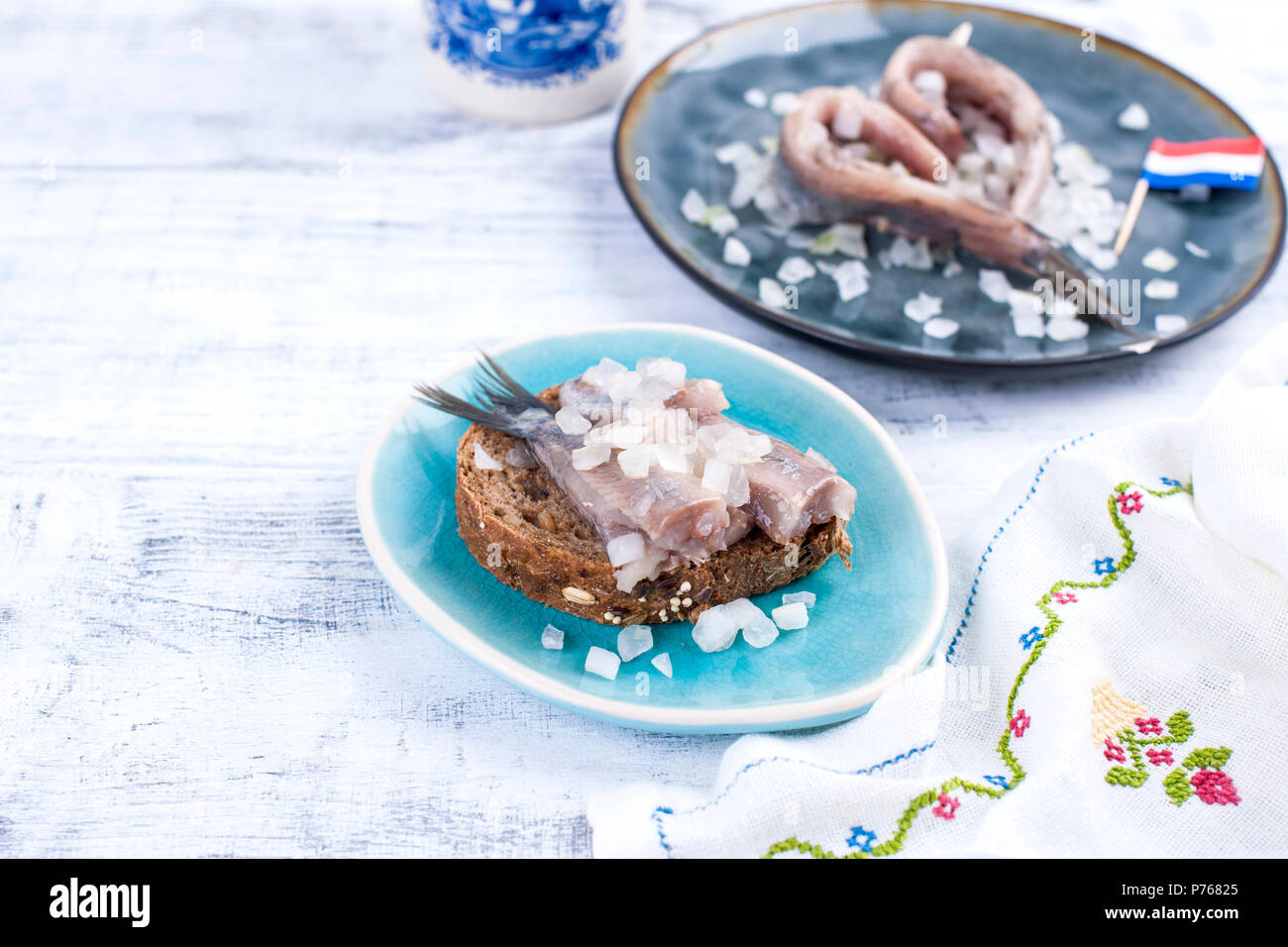 Traditional Dutch herring, with onions and toast. Fat fillets of fish