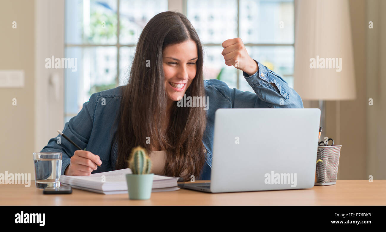 Young student woman studying at home annoyed and frustrated shouting ...
