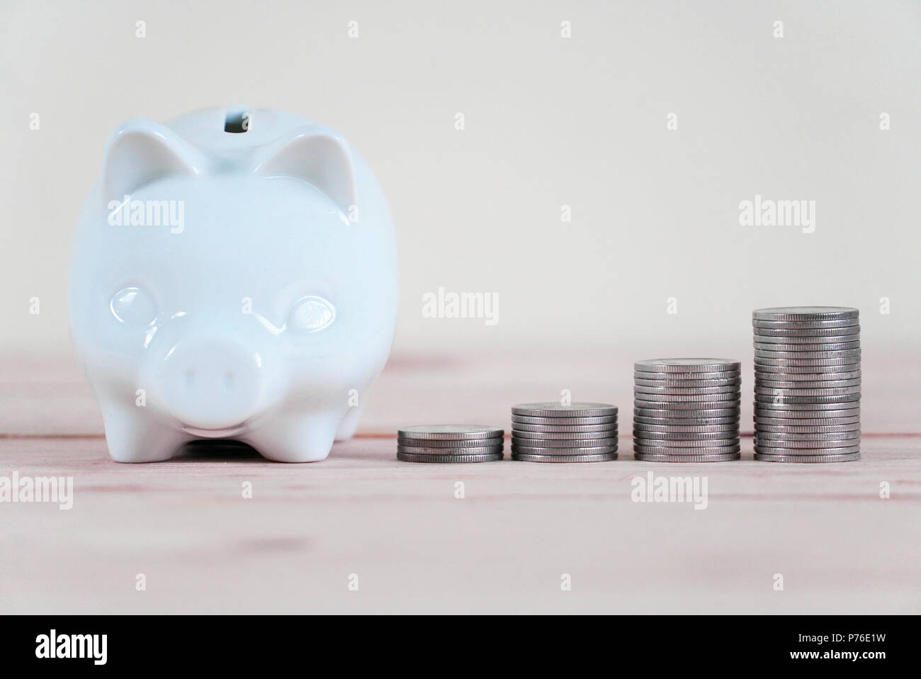 Piggy bank and stack of coin Stock Photo - Alamy