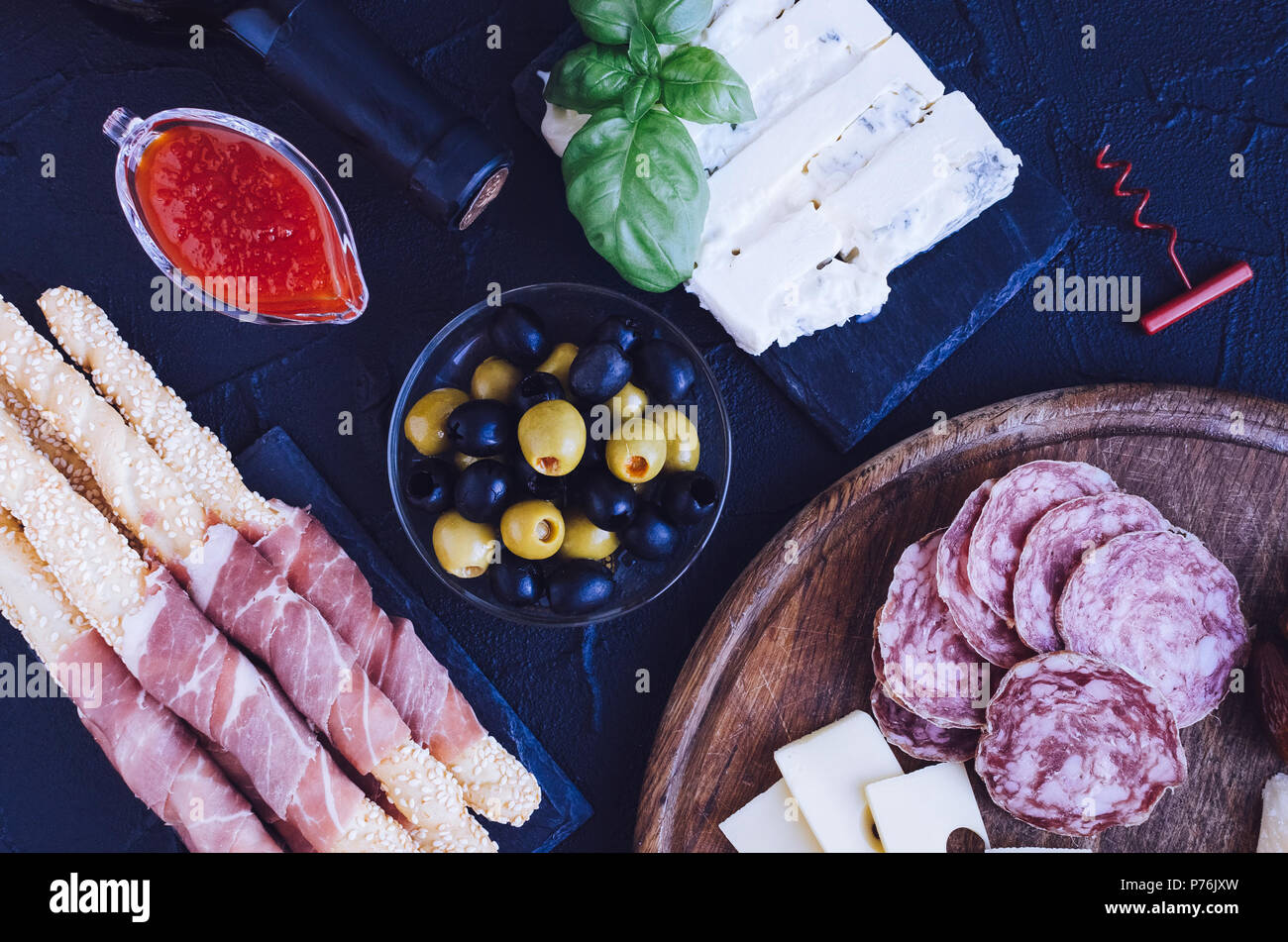 Table full of mediterranean appetizers, tapas or antipasto. Assorted ...