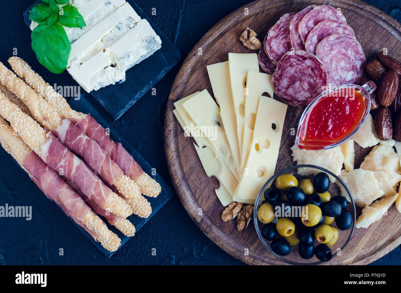 Table full of mediterranean appetizers, tapas or antipasto. Assorted ...