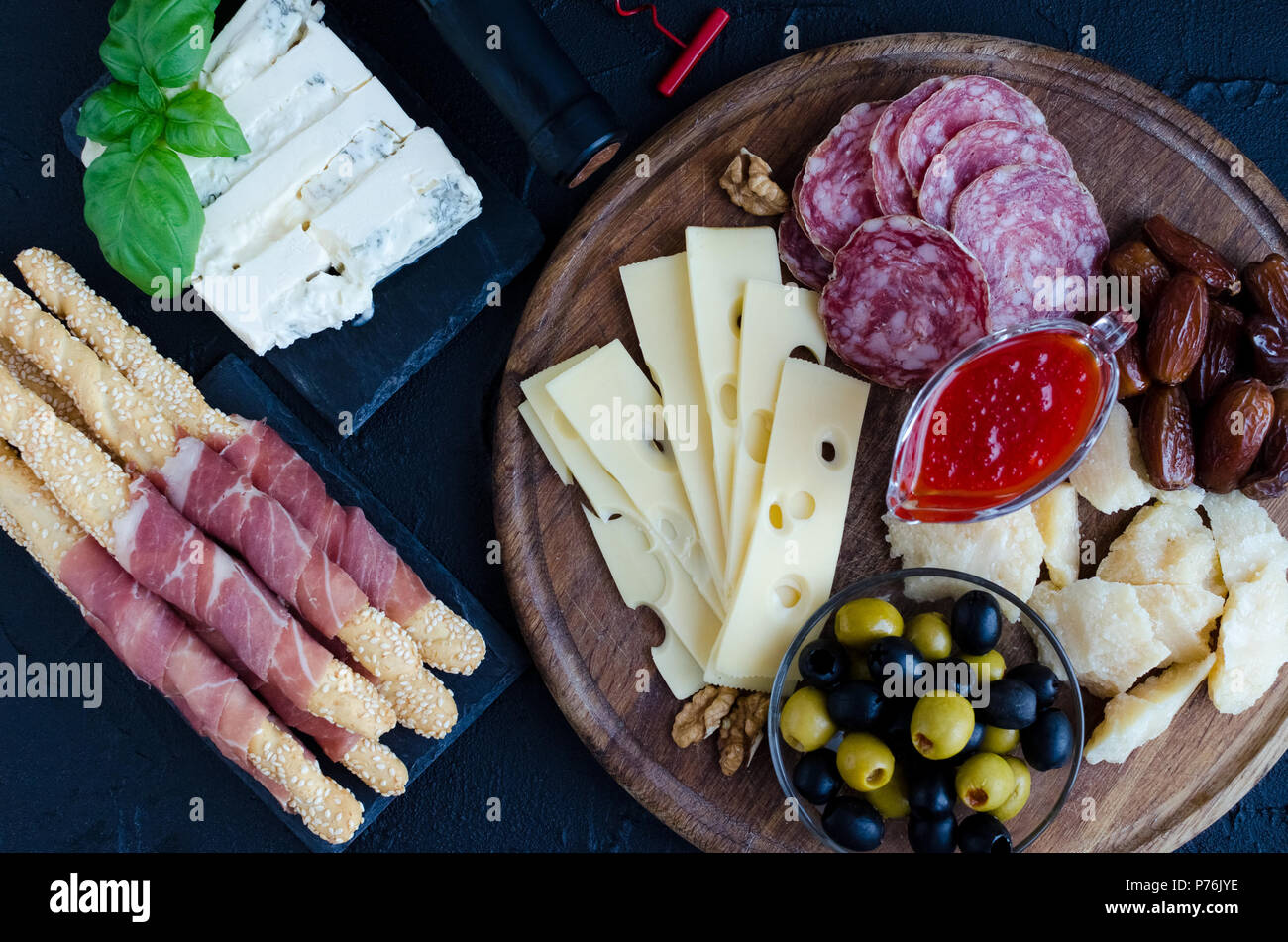 Table full of mediterranean appetizers, tapas or antipasto. Assorted ...
