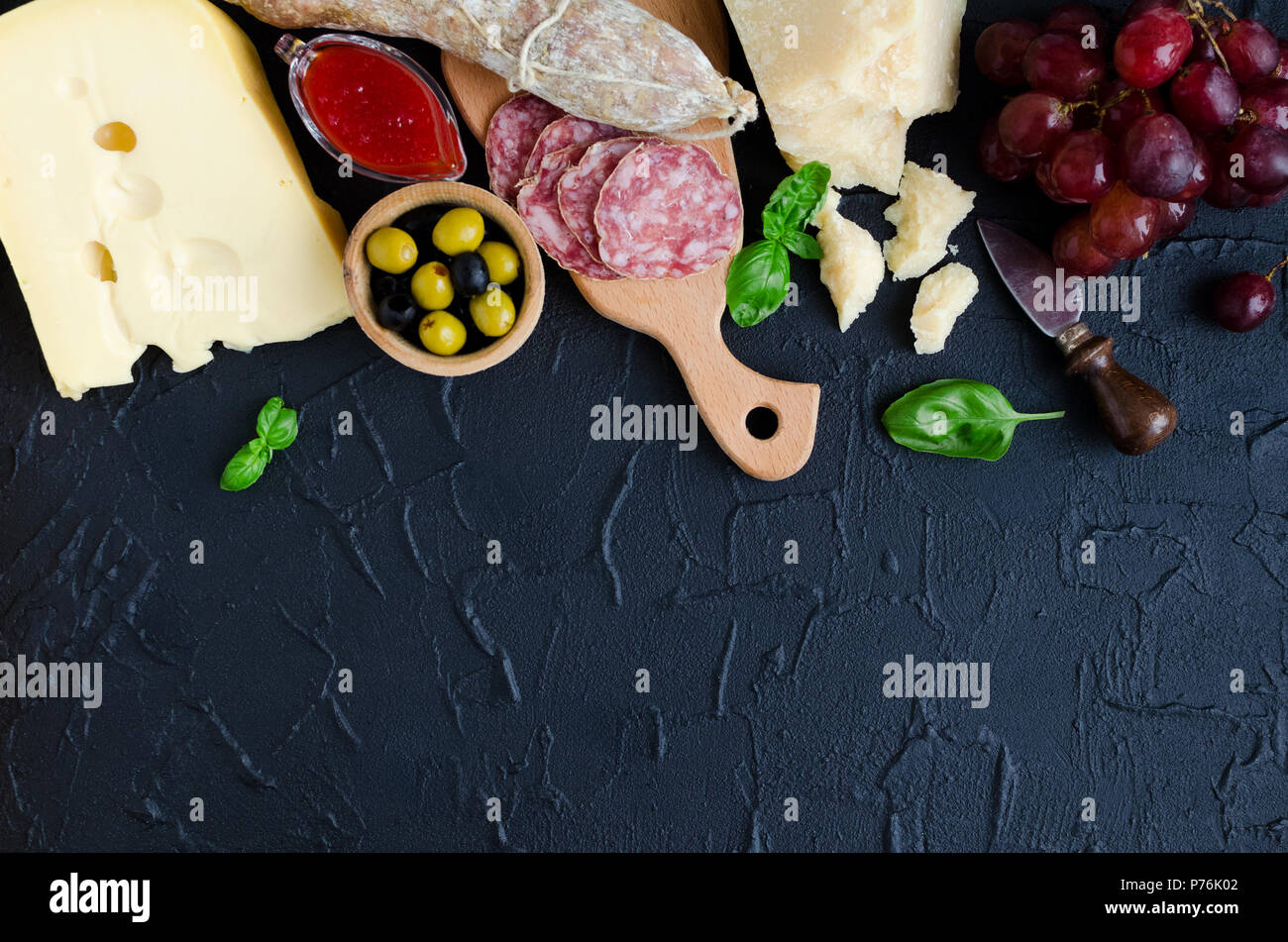 Table full of mediterranean appetizers, tapas or antipasti. Assorted ...