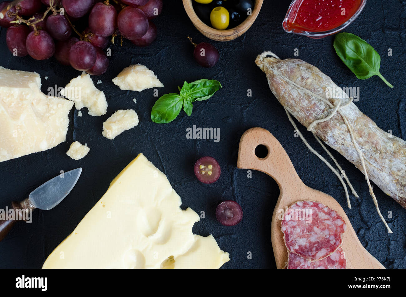 Table full of mediterranean appetizers, tapas or antipasti. Assorted ...