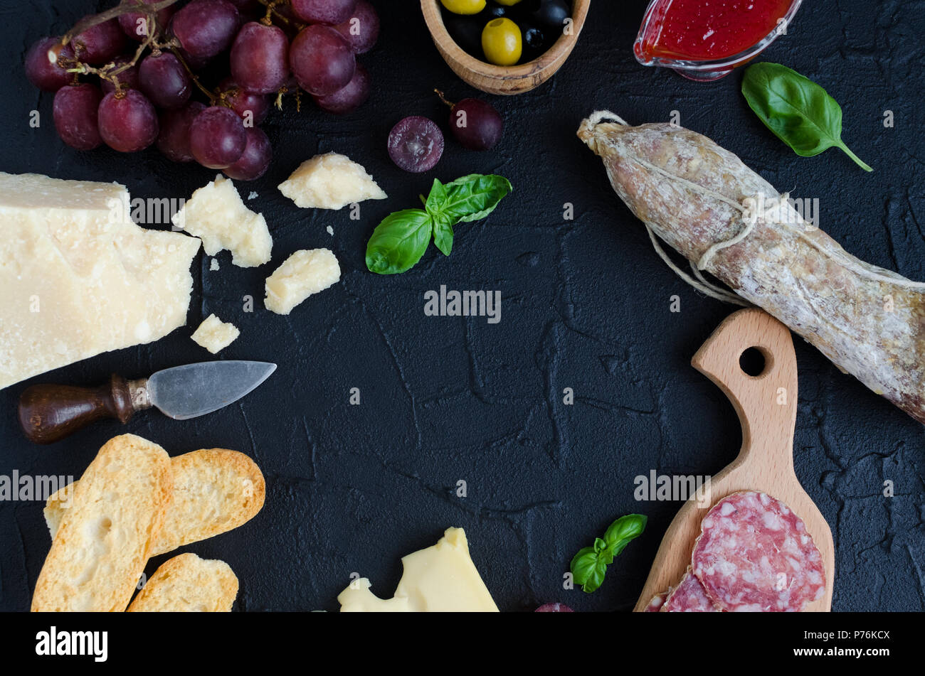 Table full of mediterranean appetizers, tapas or antipasti. Assorted ...