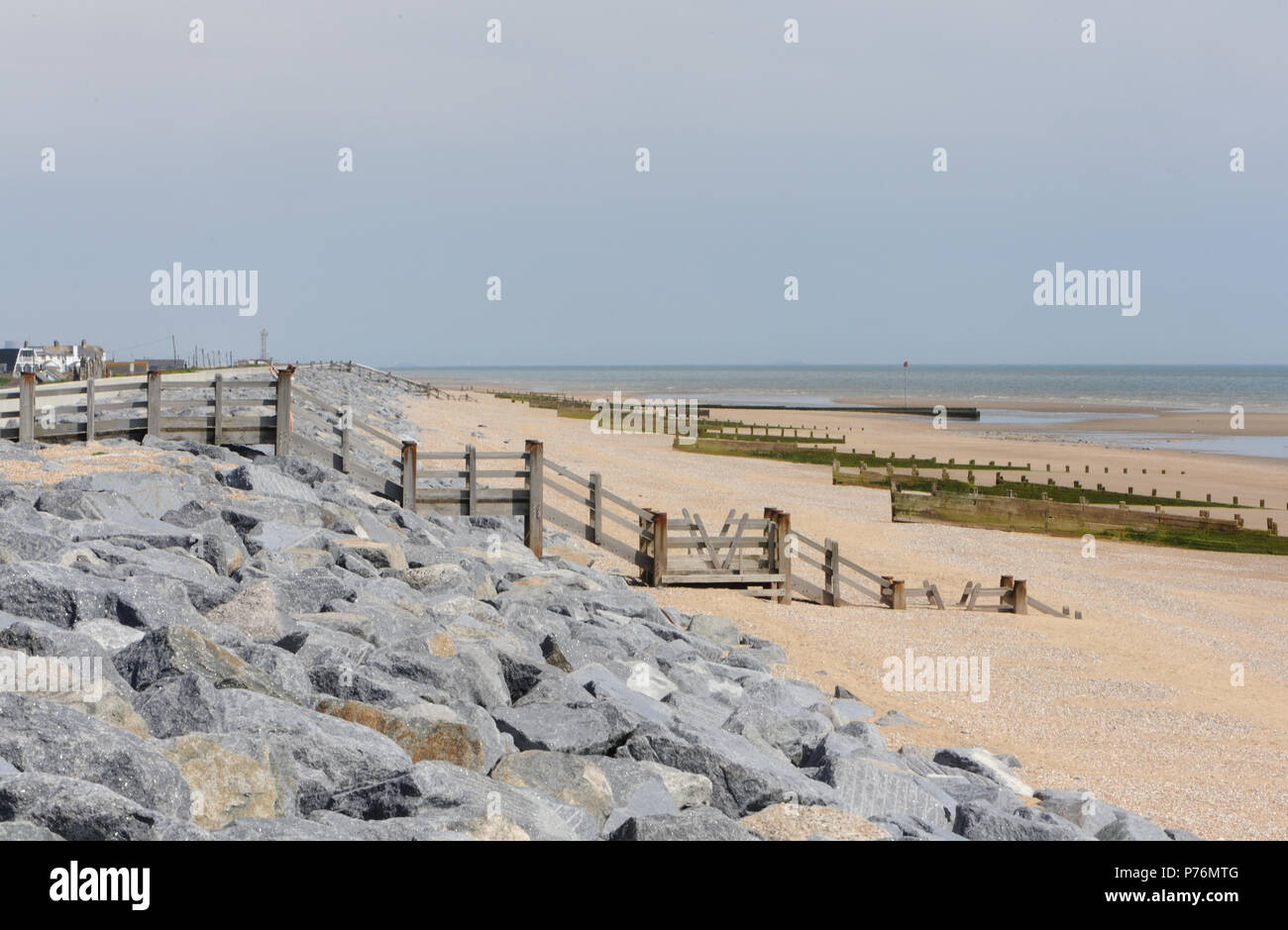 Sea defences on the beach near Camber Sands reinforcing the sea wall protecting Romney Marsh from the sea. Camber,   East Sussex, UK Stock Photo