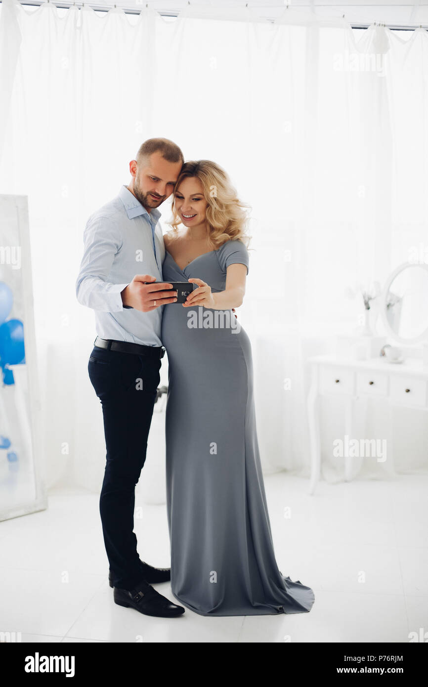 Couple handsome man and pregnant woman taking self portrait Stock Photo ...