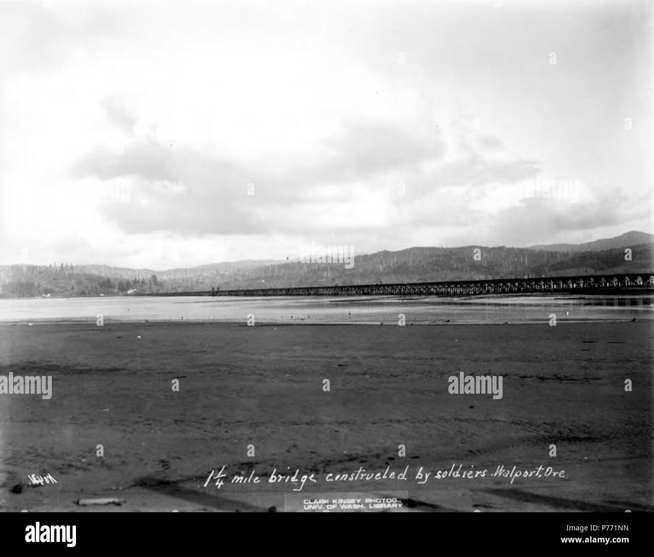 . English: 1 1/4 mile bridge built by soldiers, Warren Spruce Company, Waldport, ca. 1918 . English: Caption on image: No. 431, 1 1/4 mile bridge constructed by soldiers, Walport, Ore . PH Coll 516.4616 During World War I, the United States government created the Spruce Production Division in the Pacific Northwest in order to quickly obtain access to spruce trees to be used in constructing airplanes. The Spruce Production Division was created in reaction to a shortage in labor in the Northwest due to a lumber strike in 1917 led by the International Workers of the World. Lieutenant Colonel Bric Stock Photo