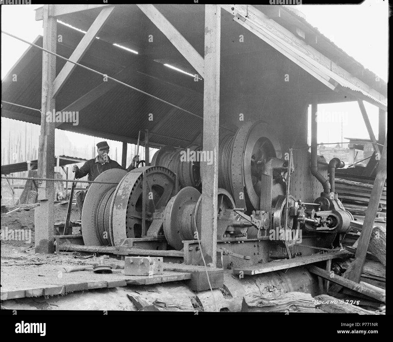 . Donkey engine. English: An employee at the Linco Log and Lumber ...
