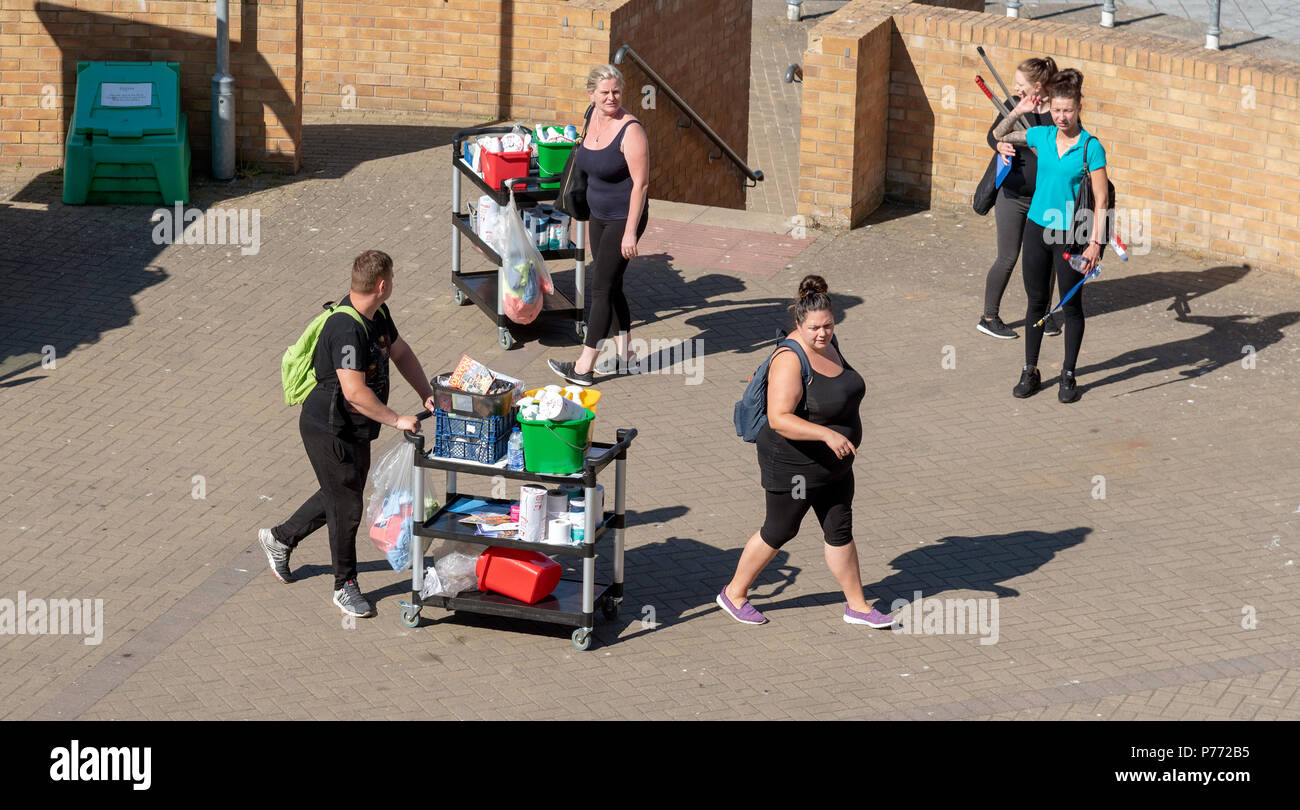Housekeeping and cleaning team on route to an assignment on a