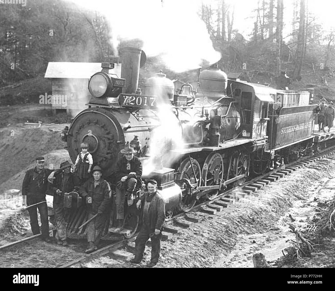 . English Crew and child with no. 2017 and flatbed railroad