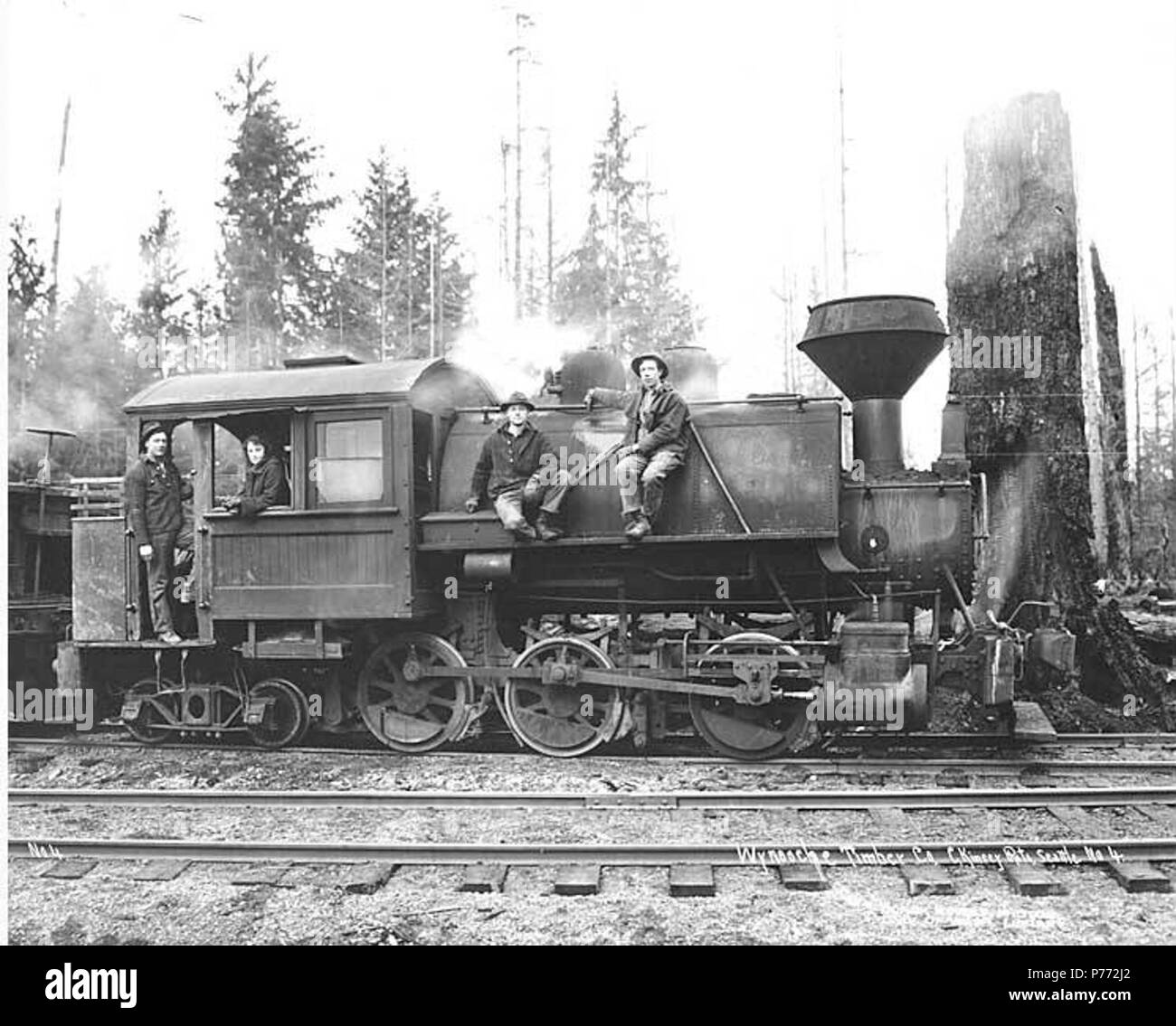 English: Crew and woman with Wynooche Timber Company's 0-6-4 saddle-tank  Baldwin locomotive, Montesano, ca. 1921 . English: Caption on image:  Wynooche Timber Co. C. Kinsey Photo, Seattle. No. 4 PH Coll