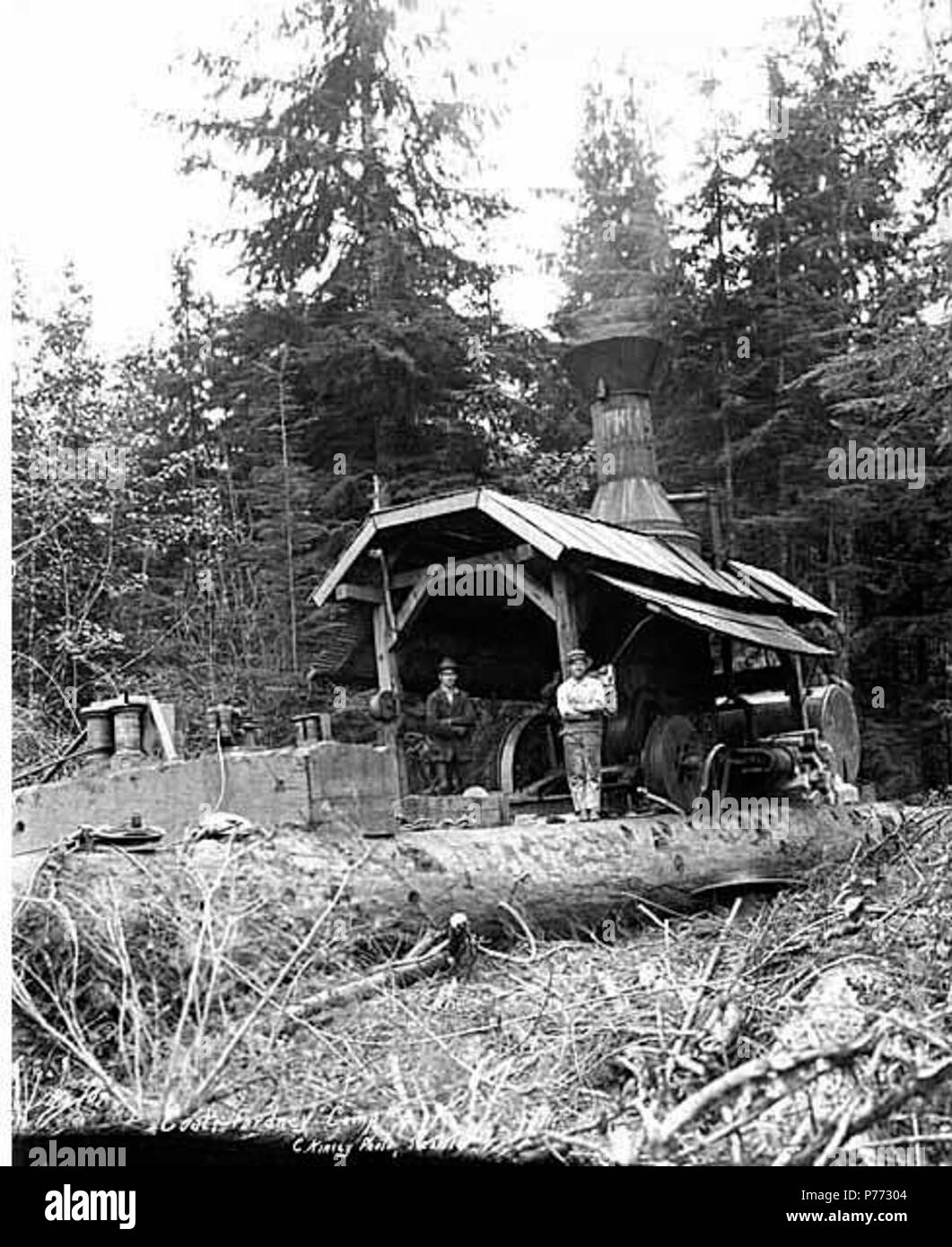. English: Donkey engine and crew, camp 4, Coats-Fordney Lumber Company, near Aberdeen, ca. 1920 . English: Caption on image: Coats-Fordney, Camp #4. C. Kinsey Photo, Seattle. No. 10 PH Coll 516.625 The Coats-Fordney Lumber Company started out as the A.F. Coats Lumber Company in 1905, headquartered in Aberdeen. It became the Coats-Fordney Lumber Company in 1910, and by 1924, it was called the Donovan-Corkery Lumber Company. Aberdeen is a city in Grays Harbor (formerly called Chehalis) County. The town was platted by Samuel Benn in 1884 on his homestead. Benn was born in New York City and in 18 Stock Photo