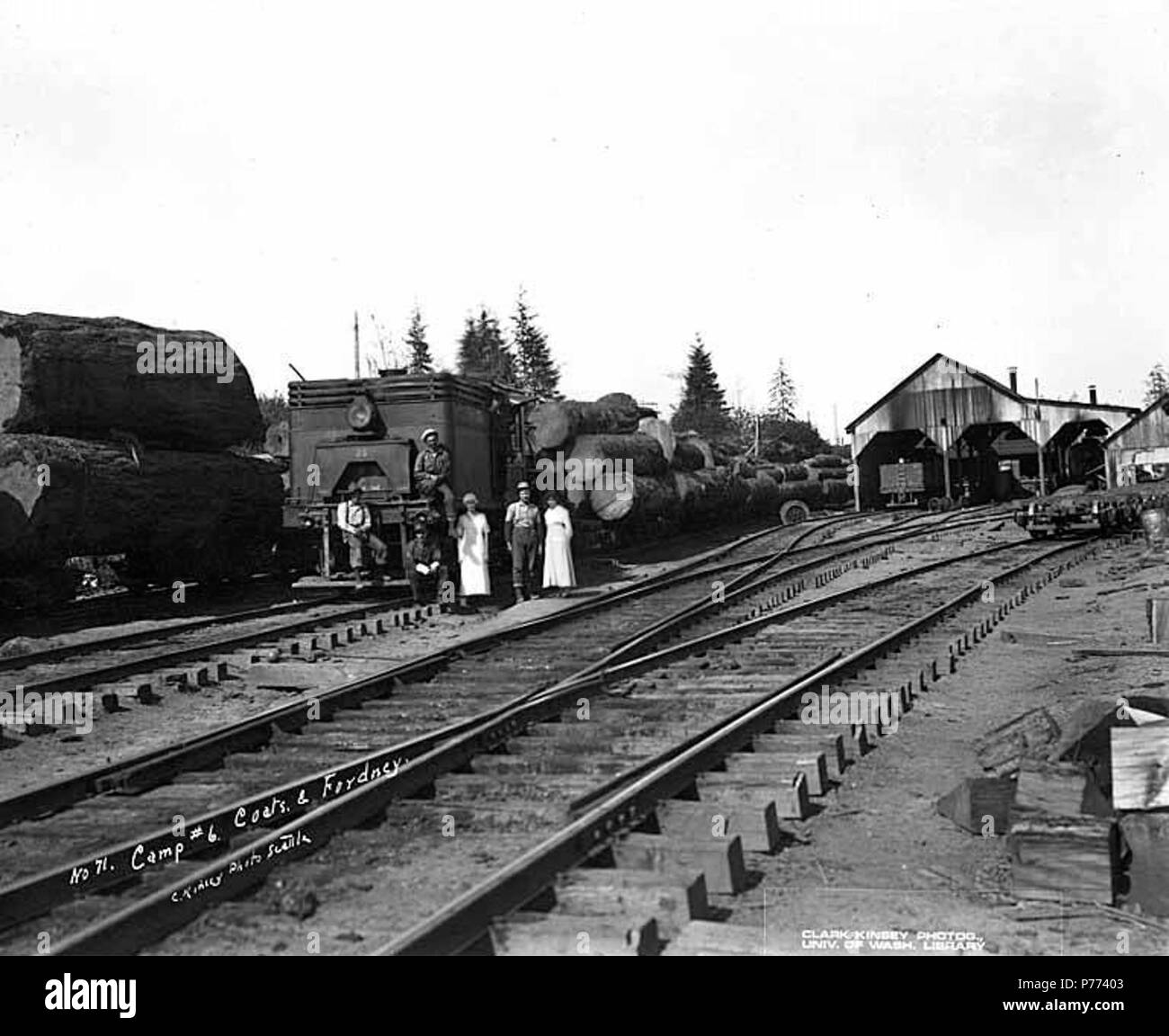 . English: Loggers and mess hall crew with locomotive and log train,Camp 6, Coats-Fordney Lumber Company, near Aberdeen, ca. 1920 . English: Caption on image: Camp #6, Coats & Fordney. C. Kinsey Photo, Seattle. No. 71 PH Coll 516.631 The Coats-Fordney Lumber Company started out as the A.F. Coats Lumber Company in 1905, headquartered in Aberdeen. It became the Coats-Fordney Lumber Company in 1910, and by 1924, it was called the Donovan-Corkery Lumber Company. Aberdeen is a city in Grays Harbor (formerly called Chehalis) County. The town was platted by Samuel Benn in 1884 on his homestead. Benn  Stock Photo