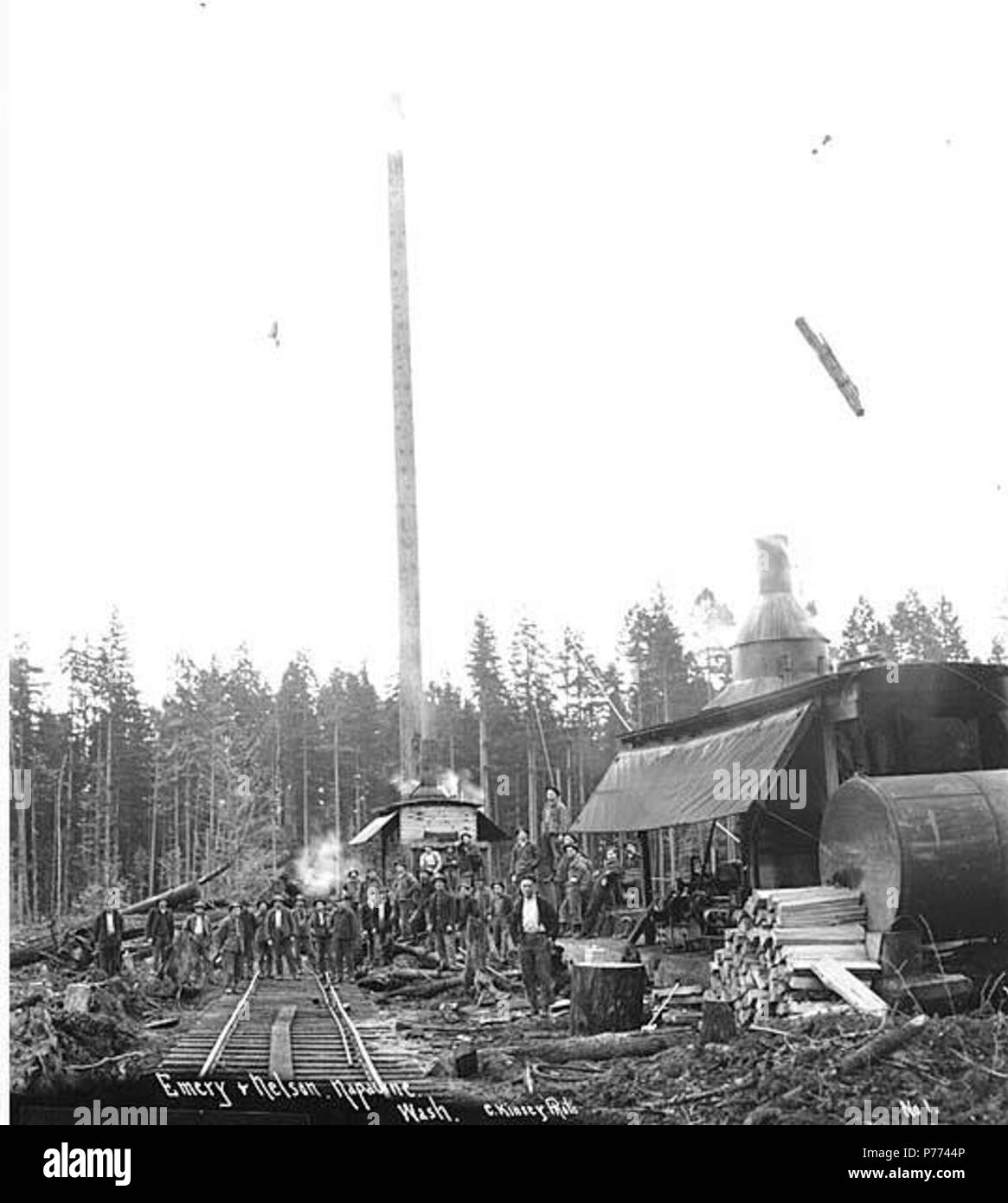 . English: Logging crew and two donkey engines, Emery and Nelson, Inc., ca. 1917 . English: Caption on image: Emery & Nelson, Napavine, Wash. C. Kinsey Photo. No. 1 PH Coll 516.1132 Emery & Nelson, Inc. was in business from ca. 1909 to ca. 1928, headquartered in Napavine in Lewis County. Napavine is seven miles southeast of Chehalis on the Newaukum River in west central Lewis County. It is on John Urquhart's Donation Land Claim. On December 17,1863, it was named by James Urquhart, using the Indian name which means small prairie. In 1873, Northern Pacific Railway officials accepted this name fo Stock Photo