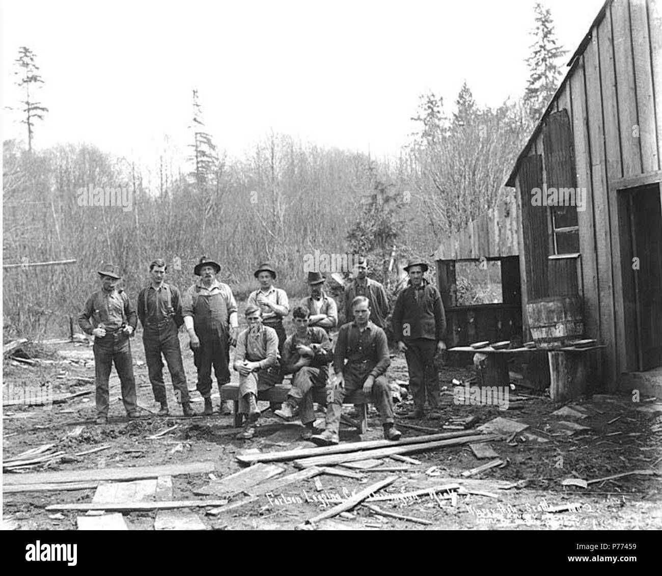 . English: Logging crew at camp, Fortson Logging Company, ca. 1917 . English: Caption on image: Fortson Logging Co., Darrington, Wash. Kinsey Photo, Seattle. No. 2 PH Coll 516.1301 The Fortson Logging Company was in business from ca. 1913 to ca. 1922, headquartered in Darrington. Darrington is a logging and sawmill community on the Sauk River nearly thirty miles east of Arlington in north central Snohomish County. It was a meeting place for Indian tribes in early days. From there five trails lead into the high mountains. Early names for this place were Sauk Portage and The Burn. The former rel Stock Photo