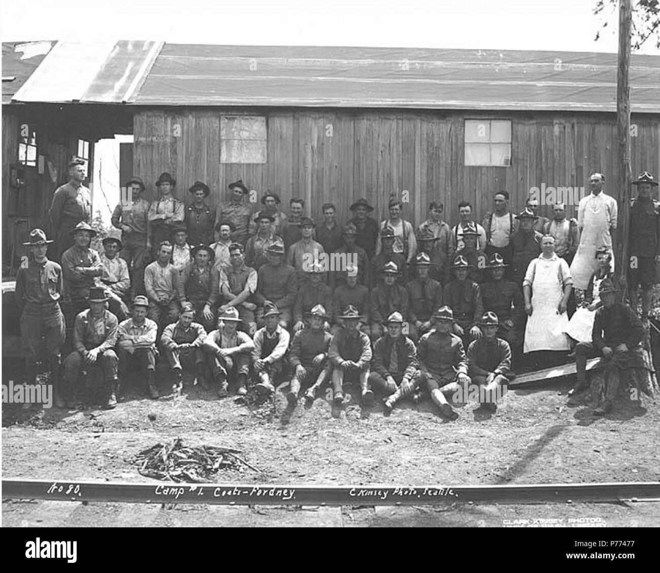 . English: Logging crew, including Spruce Production Division soldiers, at Coats-Fordney camp no. 1, ca. 1918 . English: Caption on image: Camp #1, Coats-Fordney. C. Kinsey Photo, Seattle. No. 80 . PH Coll 516.634 The Coats-Fordney Lumber Company started out as the A.F. Coats Lumber Company in 1905, headquartered in Aberdeen. It became the Coats-Fordney Lumber Company in 1910, and by 1924, it was called the Donovan-Corkery Lumber Company. Subjects (LCTGM): Lumber camps--Washington (State); United States. Army. Spruce Squadron; Coats-Fordney Lumber Company--People--Washington (State); Coats-For Stock Photo
