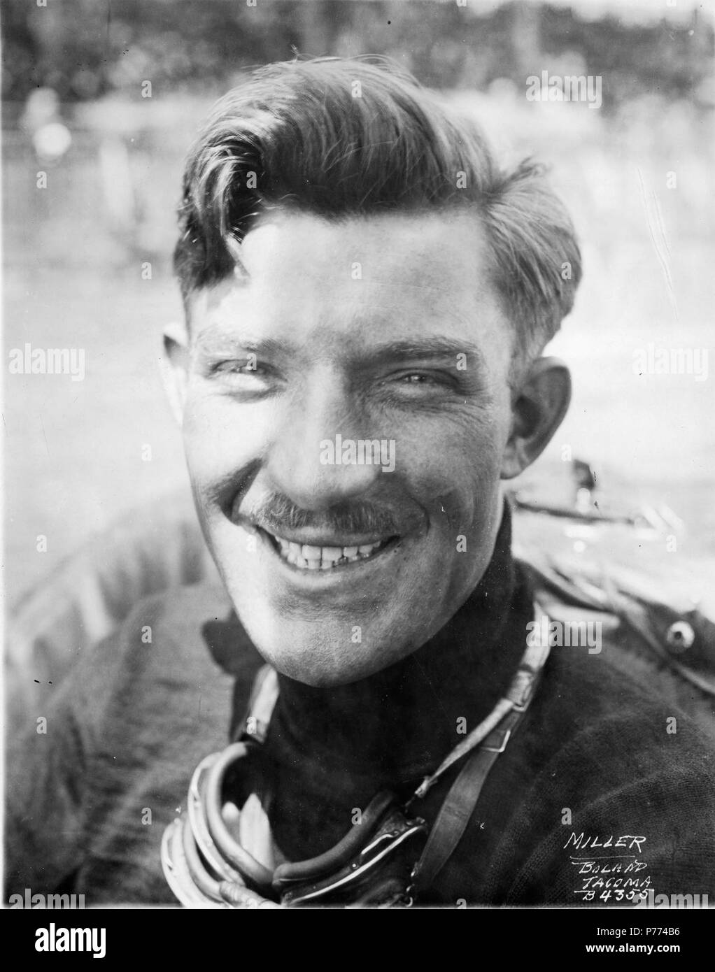 . Marvin D. Boland Collection BOLAND-B4355. ca. 1921. Informal close-up portrait of auto racer, Eddie Miller. Mr. Miller, part of the powerful four-car Duesenberg team, paid his third visit to Tacoma's Speedway in 1921. He picked up his bride from back East before arriving in Tacoma in late June, following the path laid by his former teammate, Tommy Milton, who had done the same before winning the 1920 Tacoma race. Eddie Miller in his #7 Duesenberg came in sixth in 1921 with a time of 2:39:55 and average mph of 93.70. He earned $1000 and 35 championship points. Mr. Miller was credited in build Stock Photo