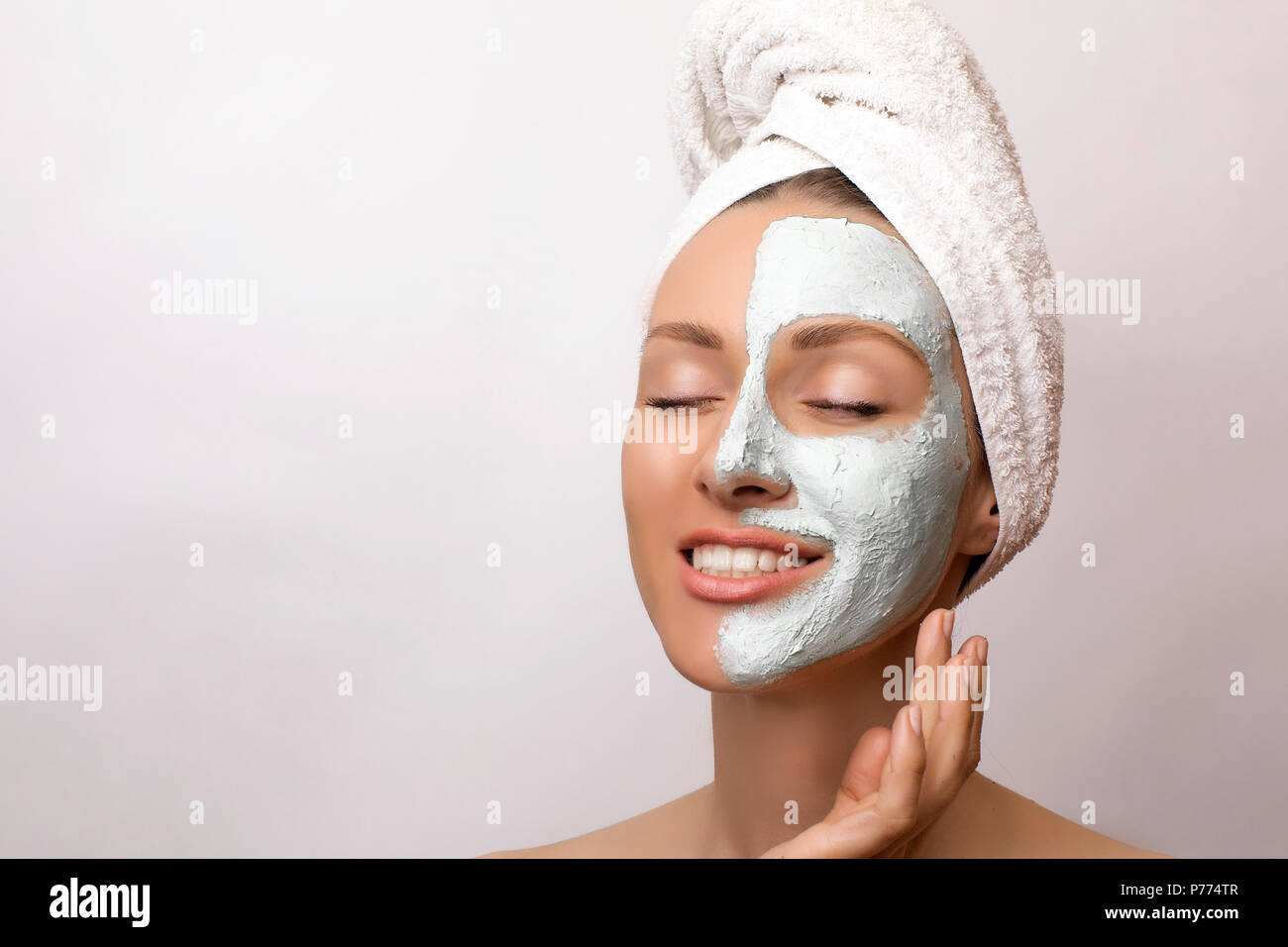 Face peeling mask, spa beauty treatment, skincare.  Close-up. Spa therapy for young woman. Clay Face Mask Stock Photo