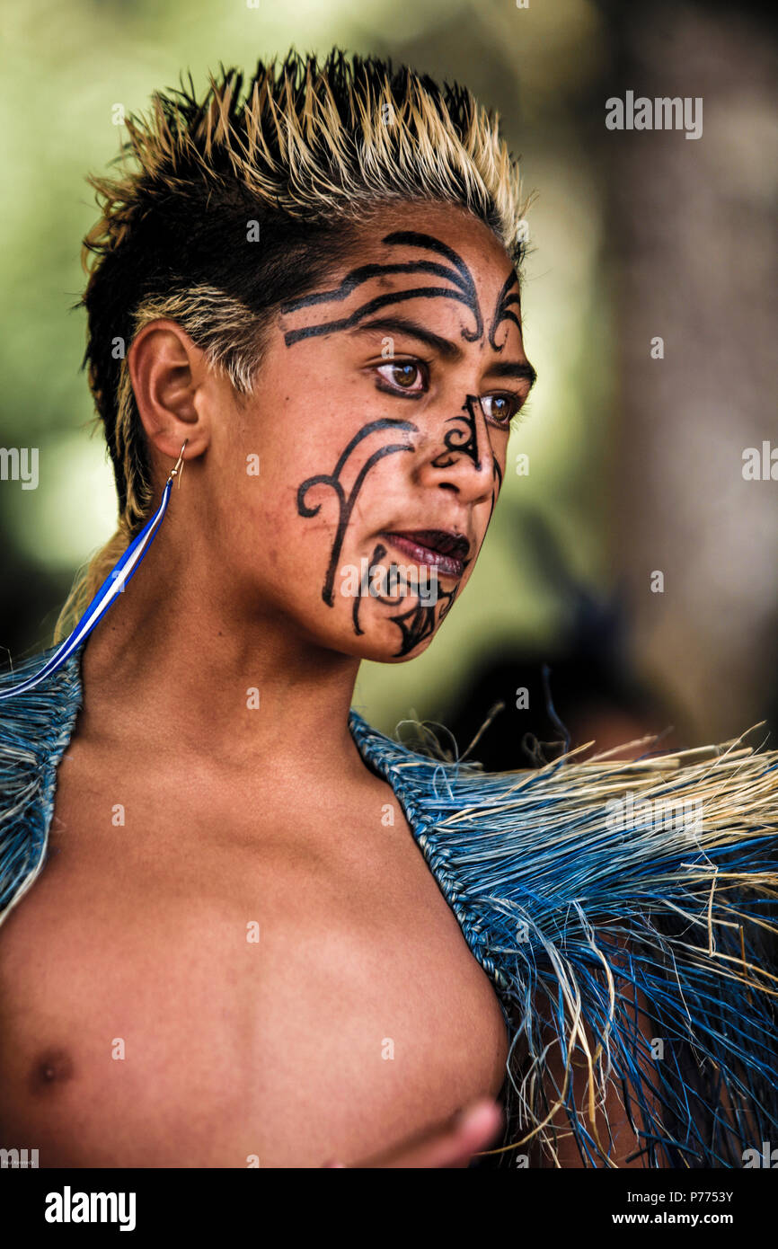 Maori performers with painted facial moko tattoo at Waitangi Day celebrations in Waitangi, New Zealand Stock Photo